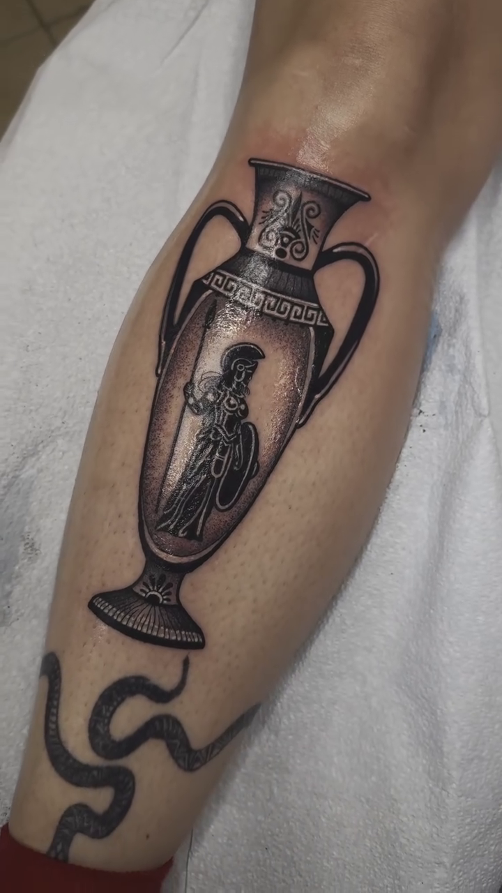 Amphora and figure realism tattoo by K9