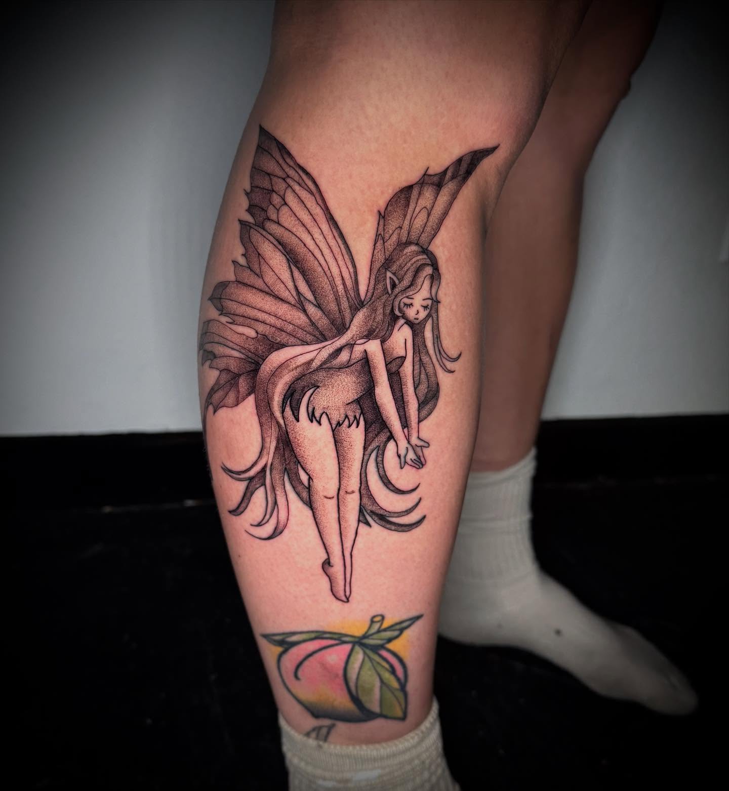 Fairy dotwork tattoo on the calf by Terence Taylor