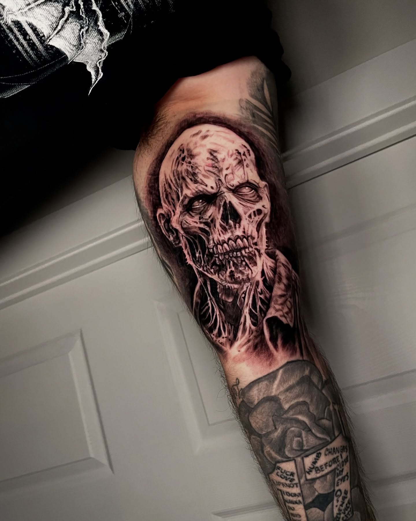 Zombie skull realism tattoo on the forearm by Eric Garcia