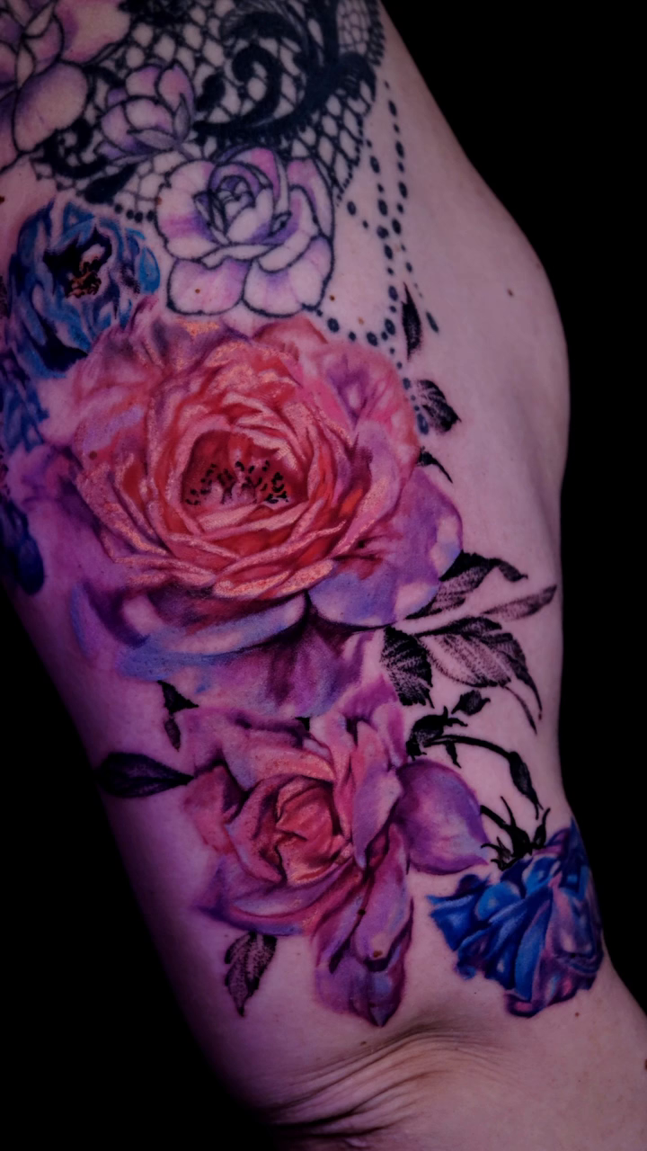 Roses and blue flowers realism tattoo by Colorful Tattoos by Cody Dean