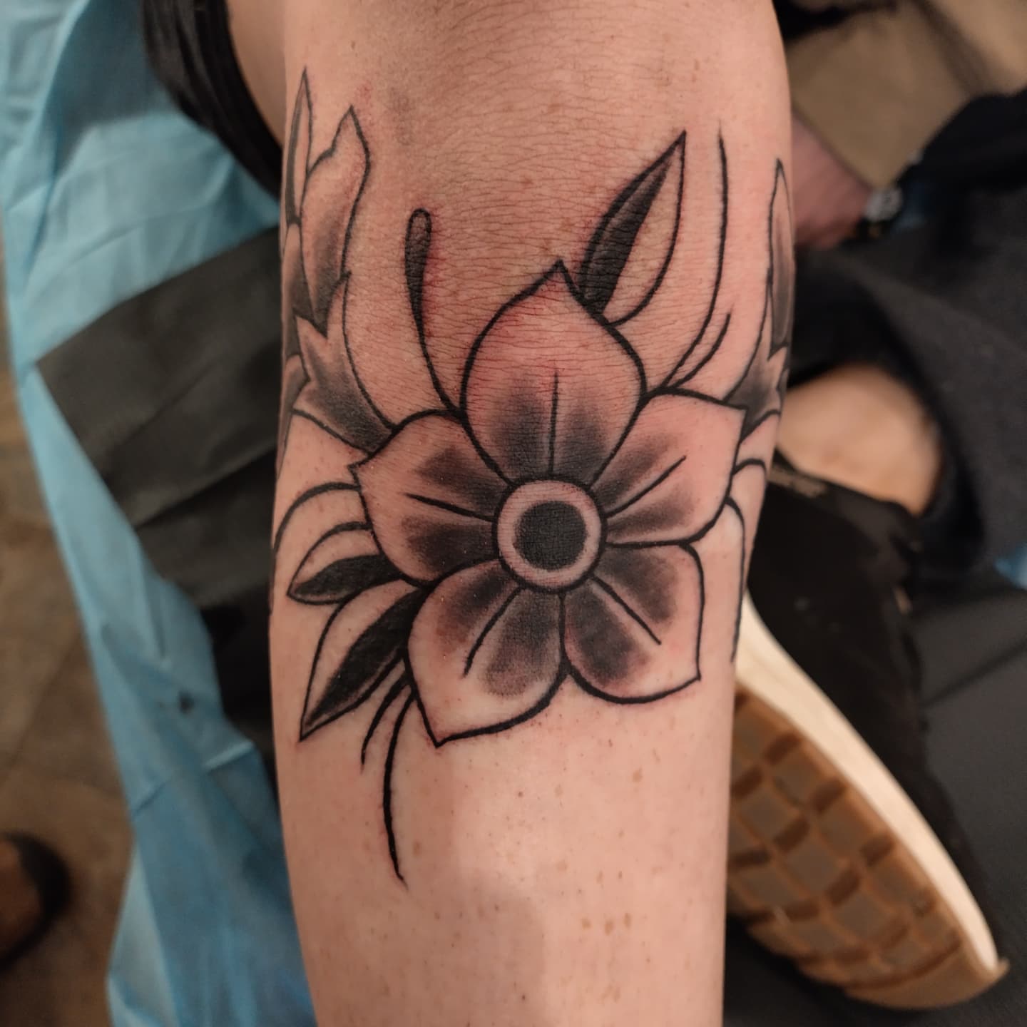 Flower black and grey tattoo on the forearm by Matt Williamson