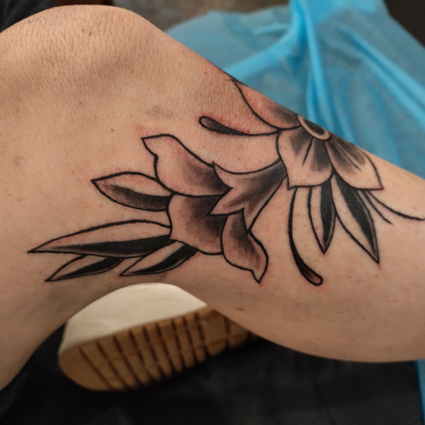 Lily black and grey tattoo on the forearm by Matt Williamson