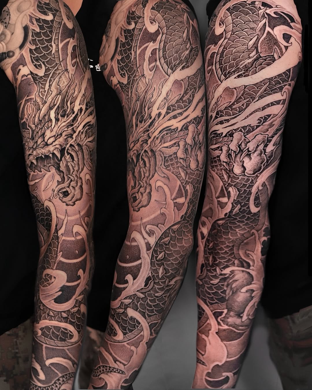 Dragon and waves Japanese tattoo on the upper arm by Kubo