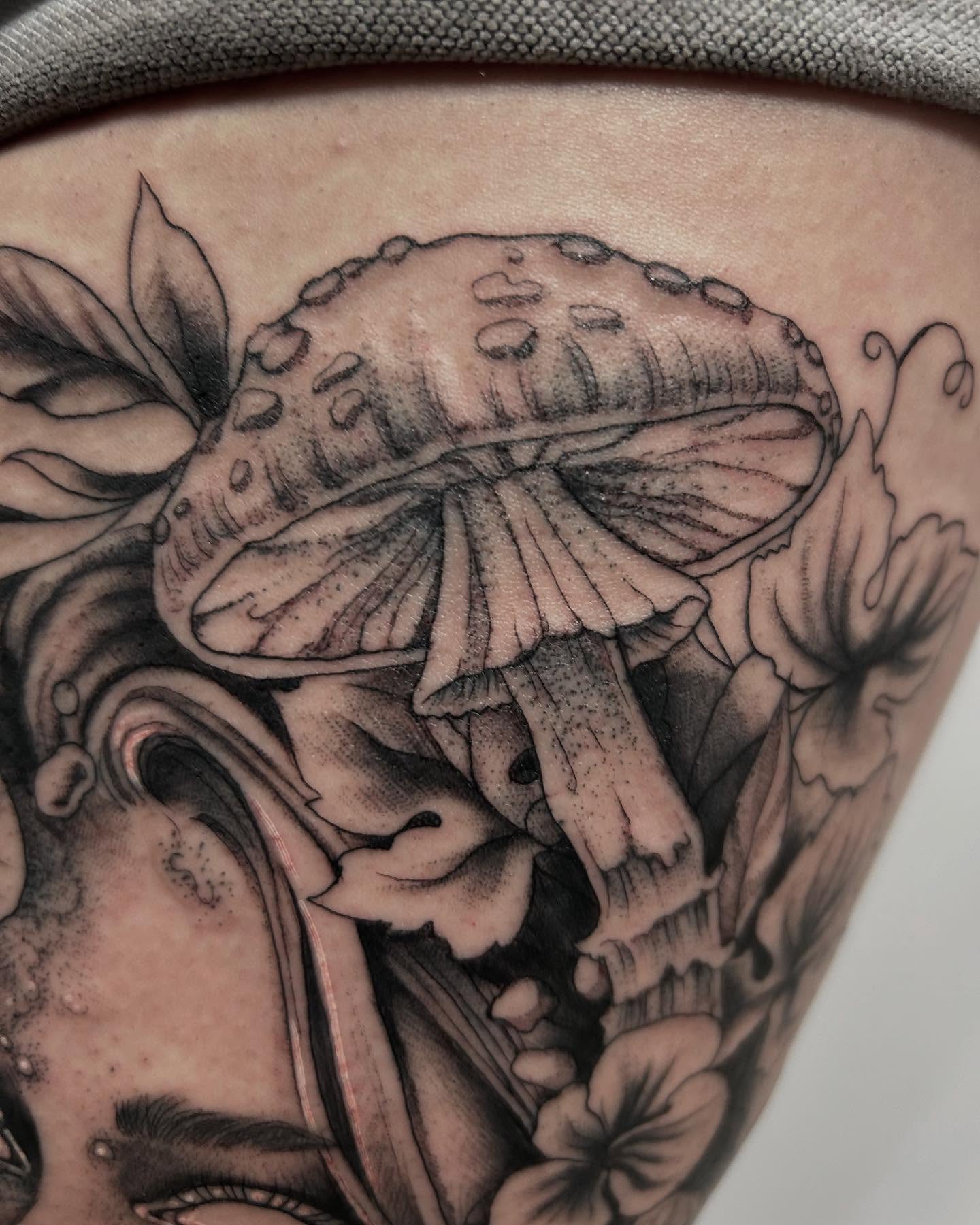 Mushroom realism tattoo on the thigh by Deanna Louise
