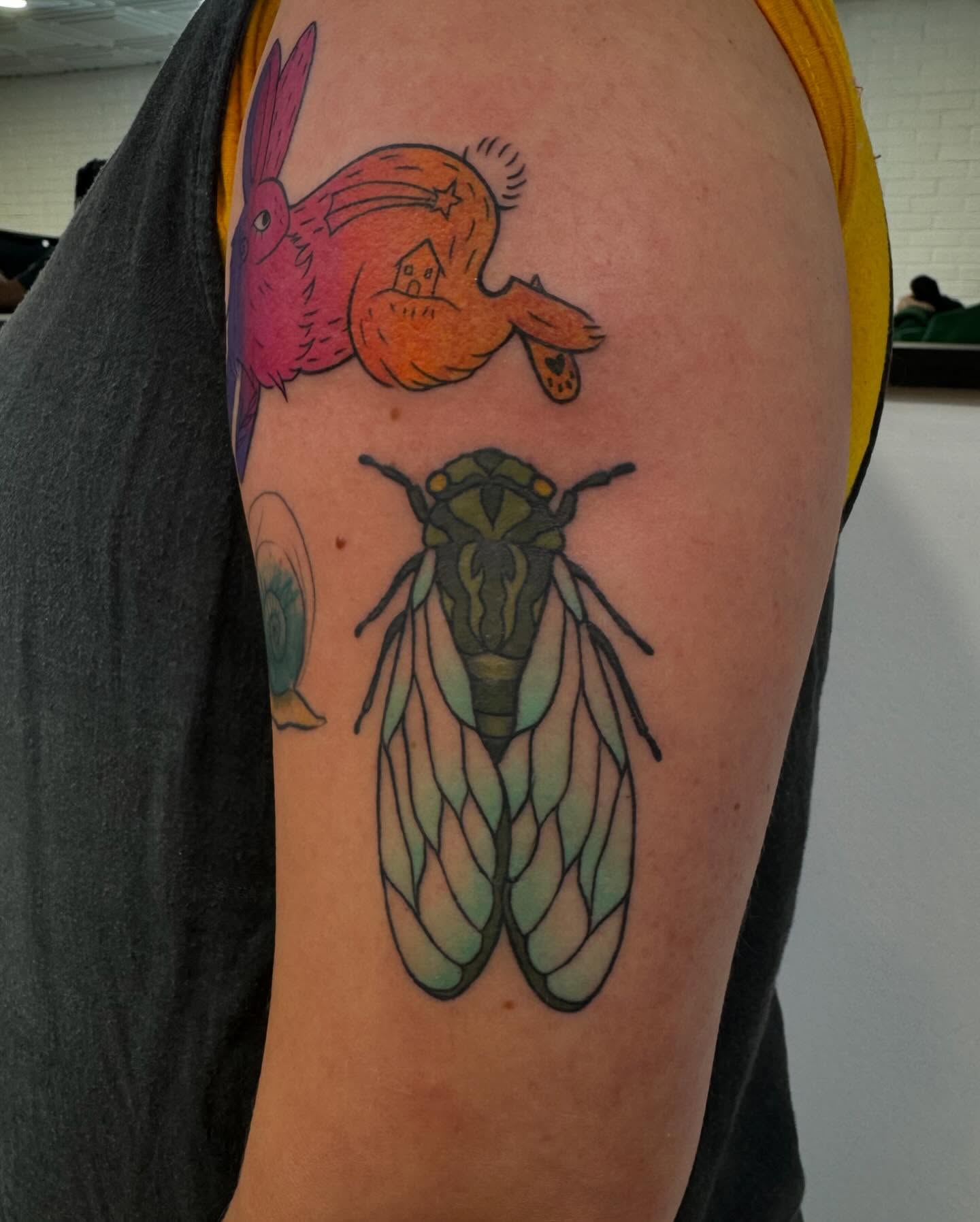 Insect and rabbit illustrative tattoo on the shoulder by Makayla Dupre