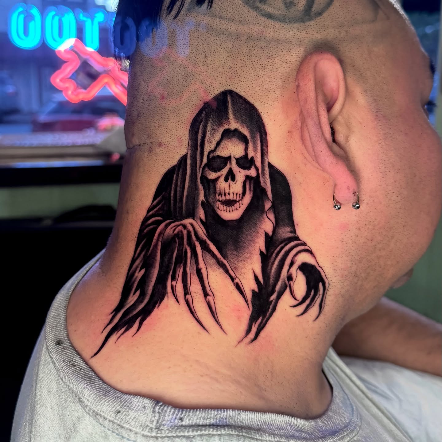 Grim reaper realism tattoo on the neck by Pavel