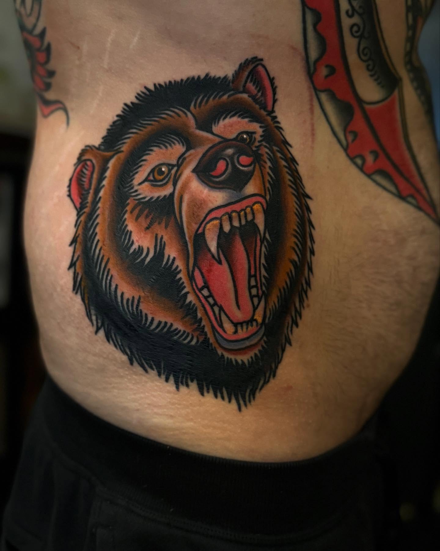 Bear American traditional tattoo on the ribs by Ross K. Jones Tattoos, San Francisco, California