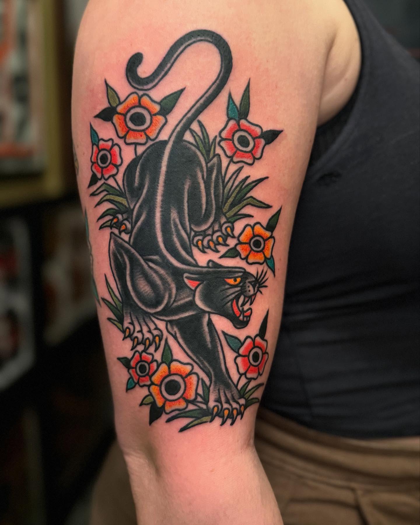 Panther and flowers American traditional tattoo on the forearm by Ross K. Jones Tattoos, San Francisco, California
