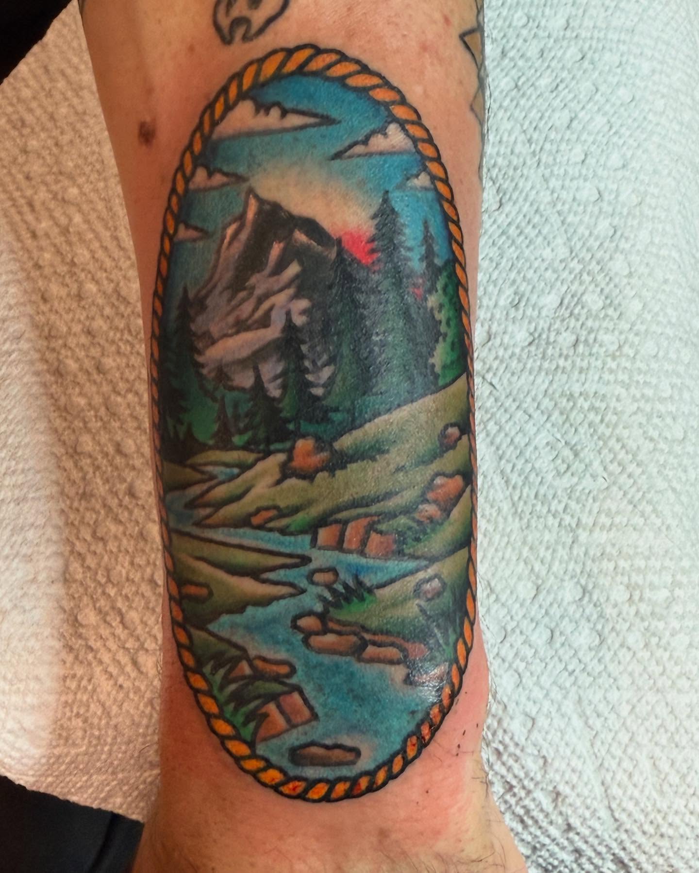 Mountain landscape realism tattoo on the forearm by Ross K. Jones Tattoos, San Francisco, California
