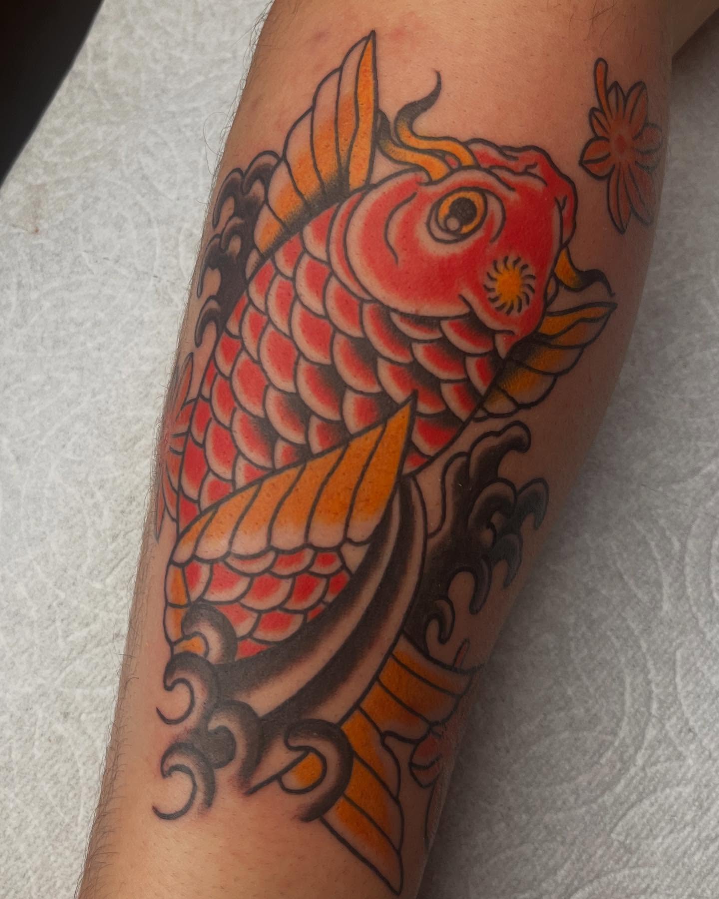 Koi fish American traditional tattoo on the forearm by Mariah Nguyen