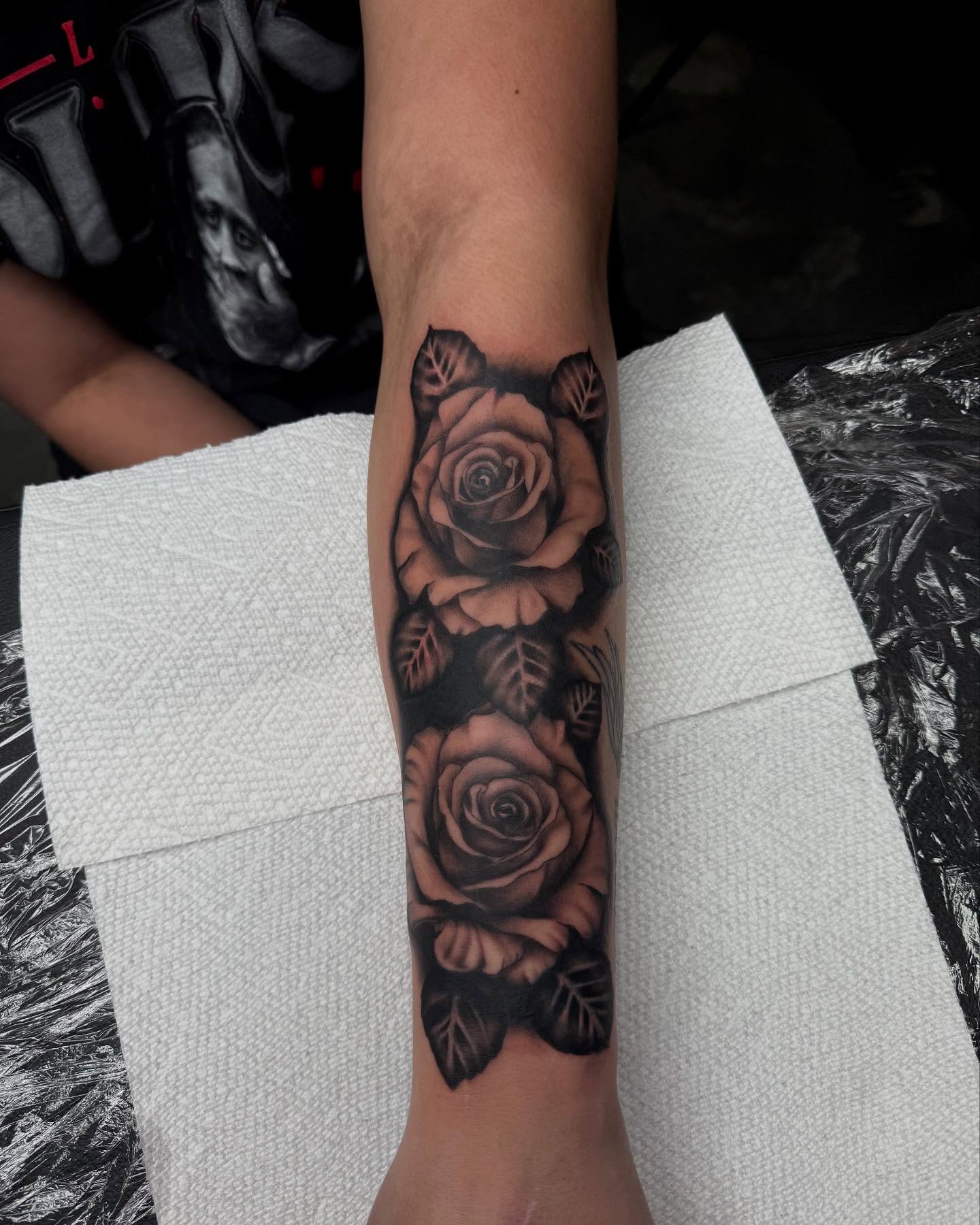 Roses black and grey tattoo on the forearm by Kylee langford 🧿