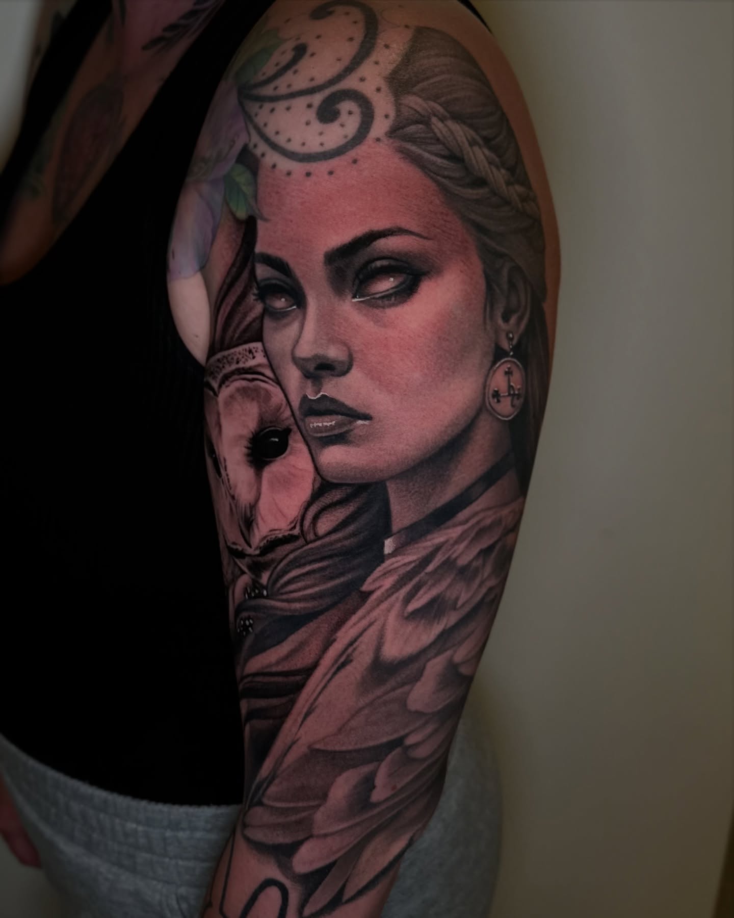 Woman's face realism tattoo on the forearm by Junior Nunez