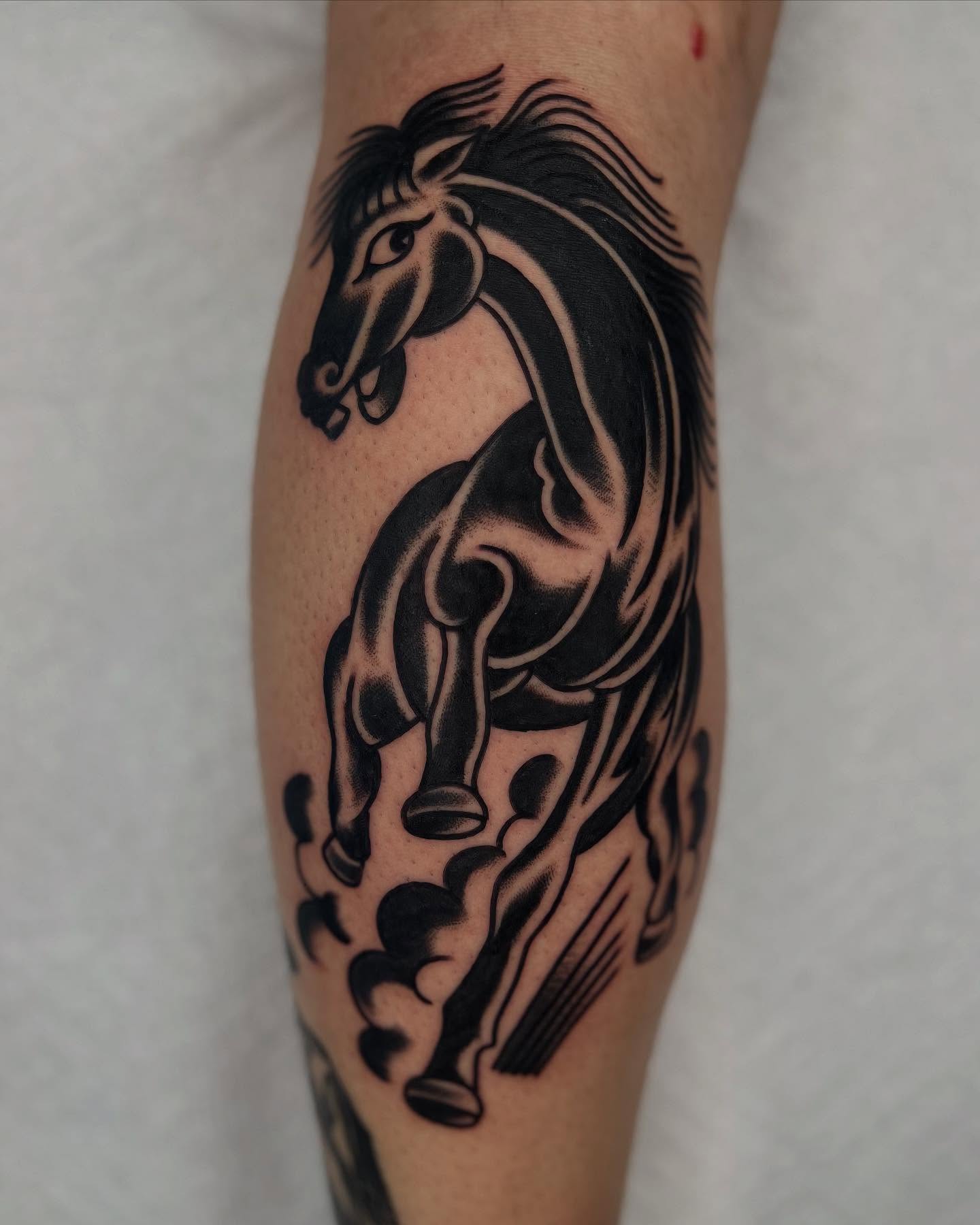 Galloping horse black and grey tattoo on the forearm by zach arlan, Kansas City, Missouri