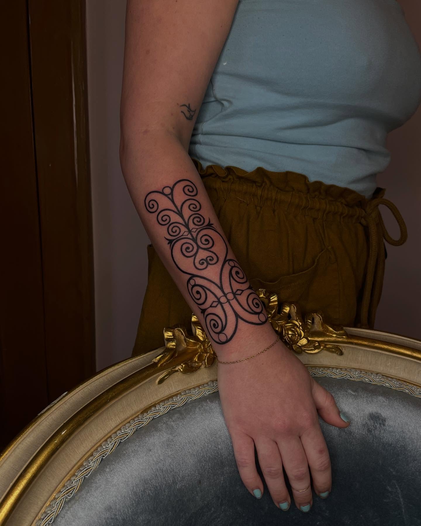 Scrollwork ornamental tattoo on the forearm by Danika Brooke 🧿