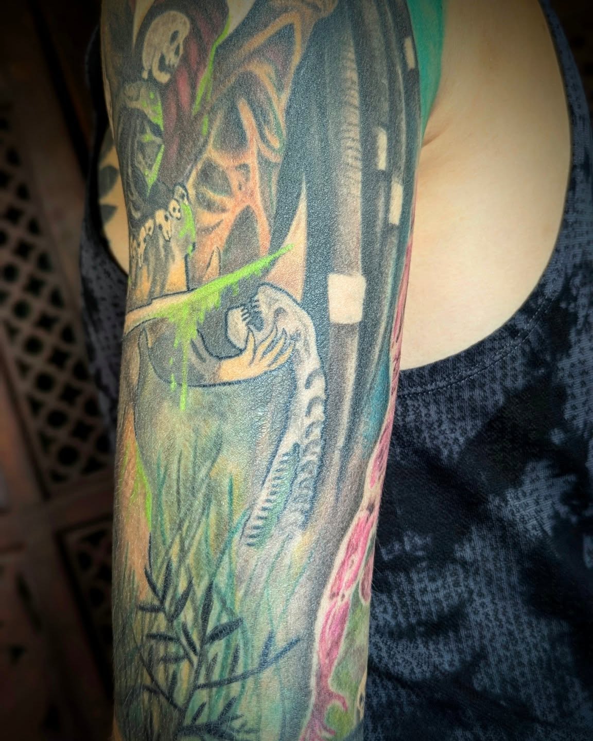 Skeleton and green energy American traditional tattoo on the forearm by Jou Smile (Jo)