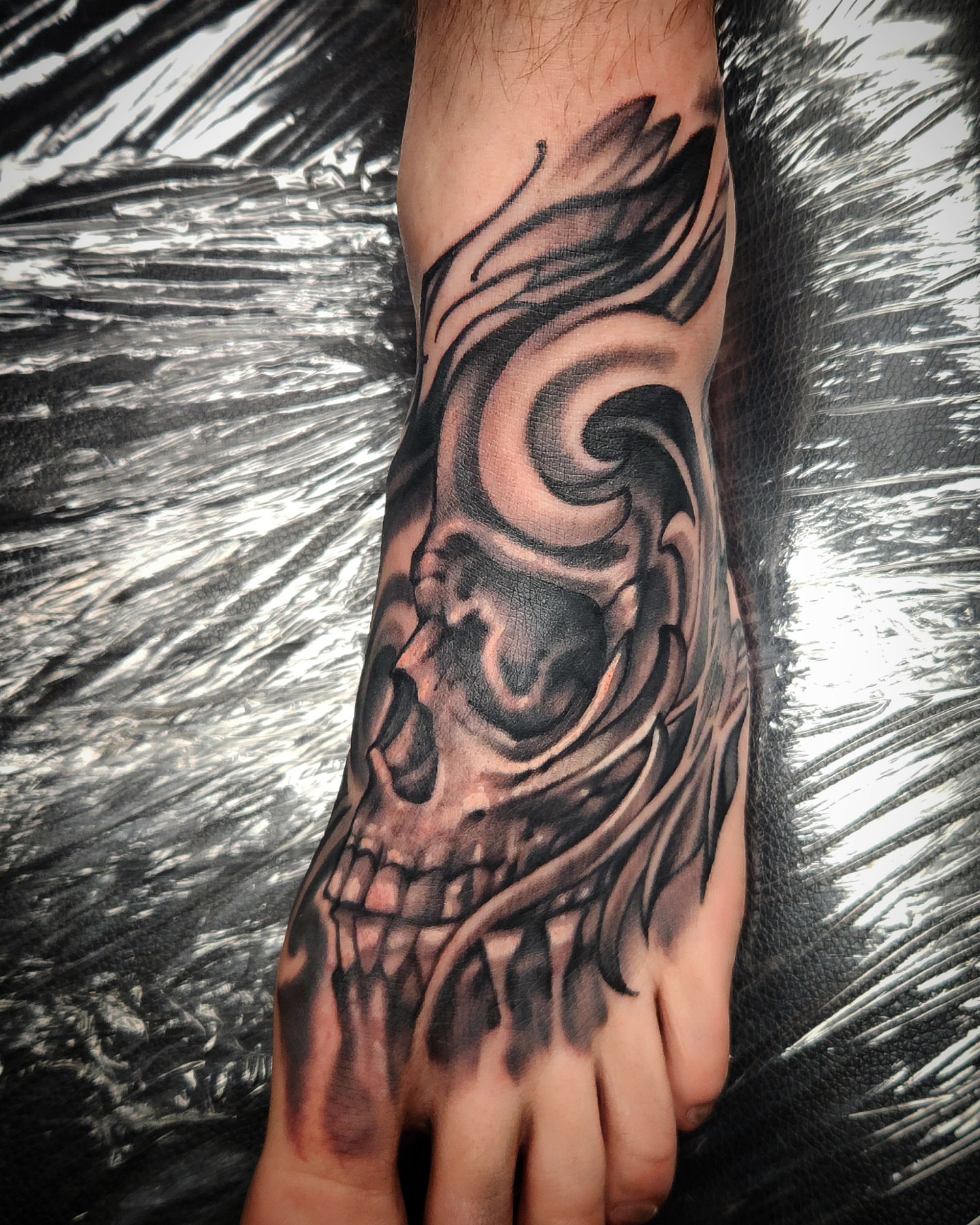 Skull realism tattoo on the foot by Jack Jr Mora