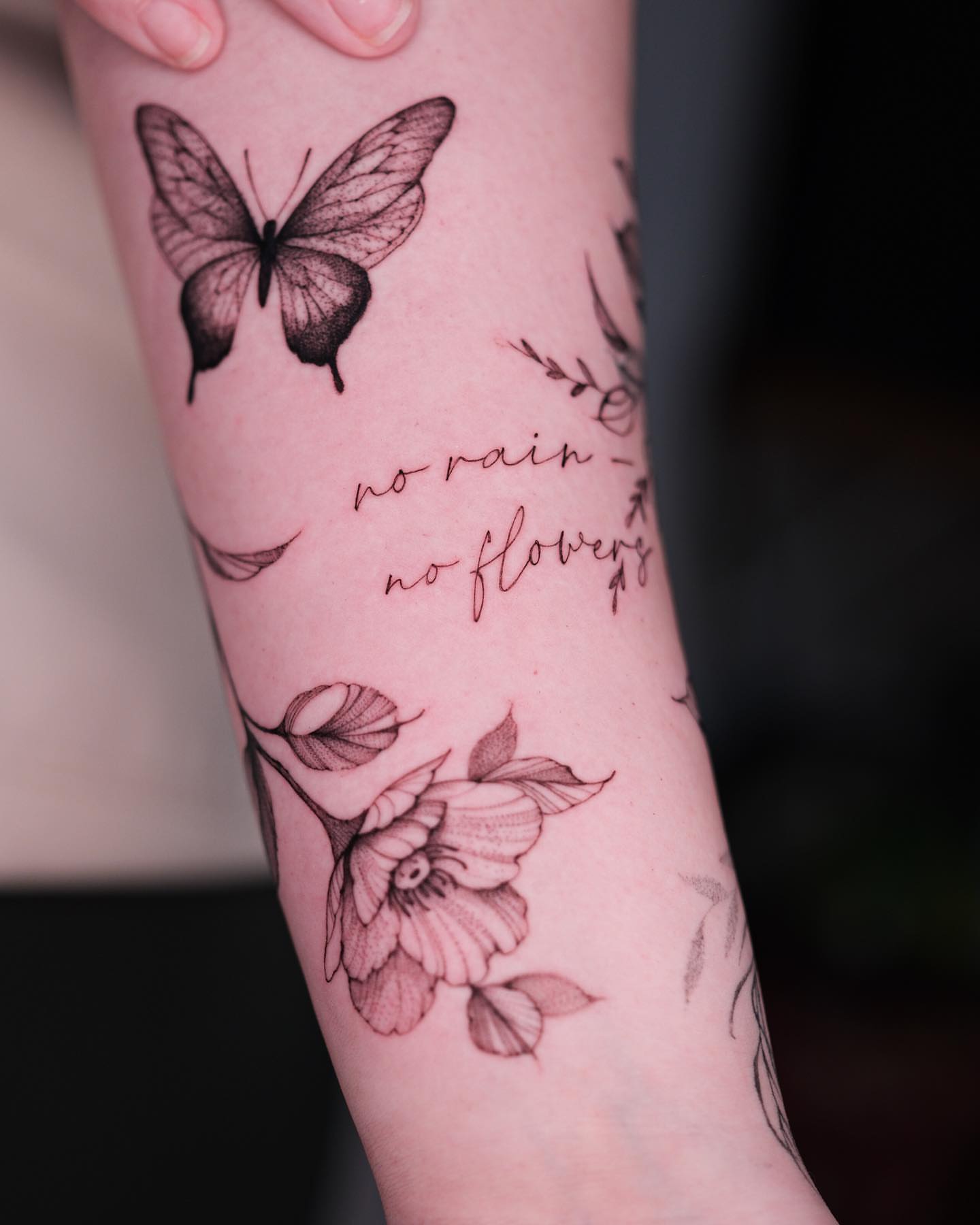 Butterfly and flowers dotwork tattoo on the forearm by Tattoo artist in Boston