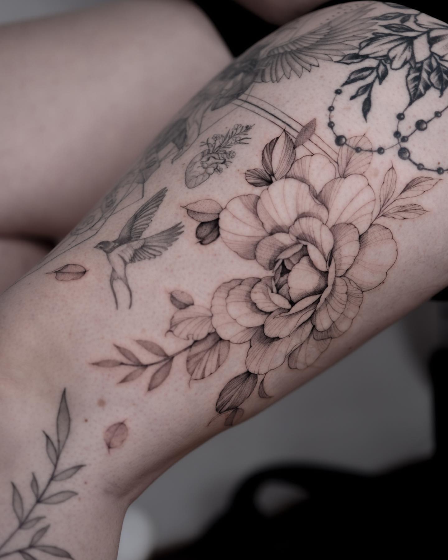 Floral bouquet realism tattoo on the forearm by Tattoo artist in Boston