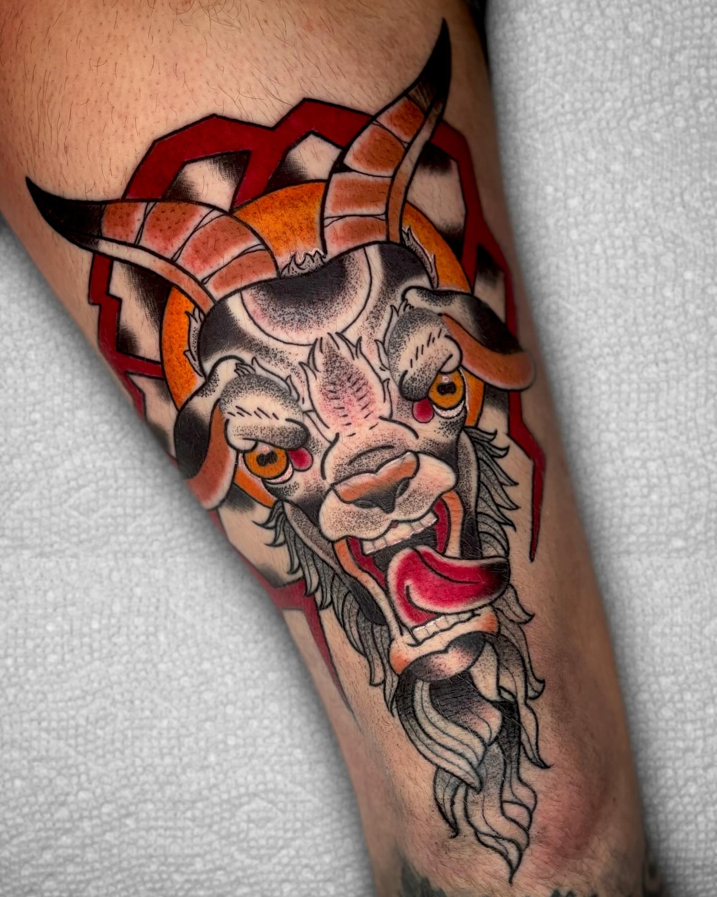 Goat head American traditional tattoo on the forearm by Todd Showdown