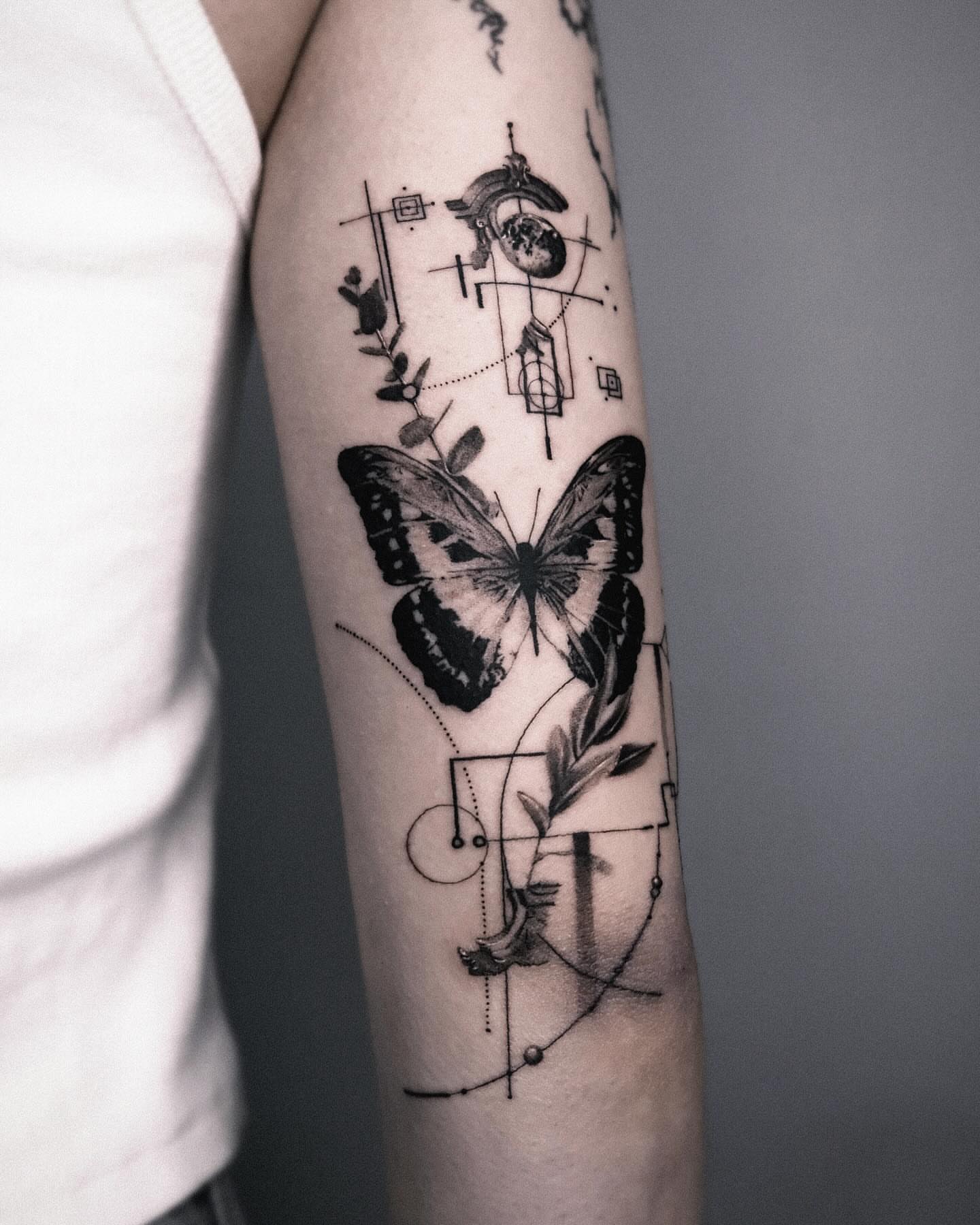 Butterfly geometric tattoo on the forearm by Seraph Geometry