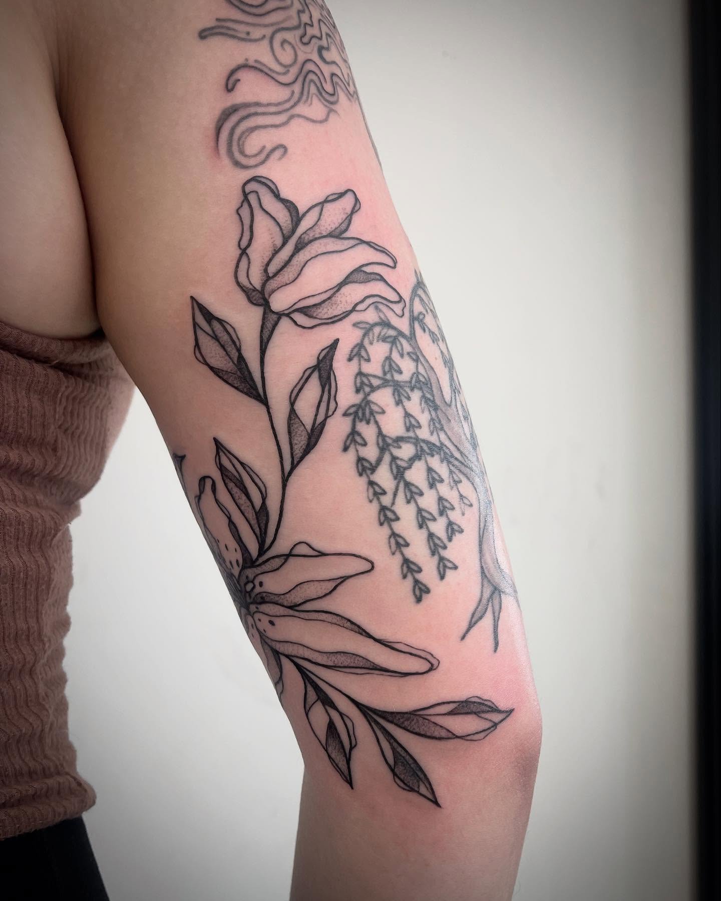 Rose and willow dotwork tattoo on the forearm by Miesha Busker