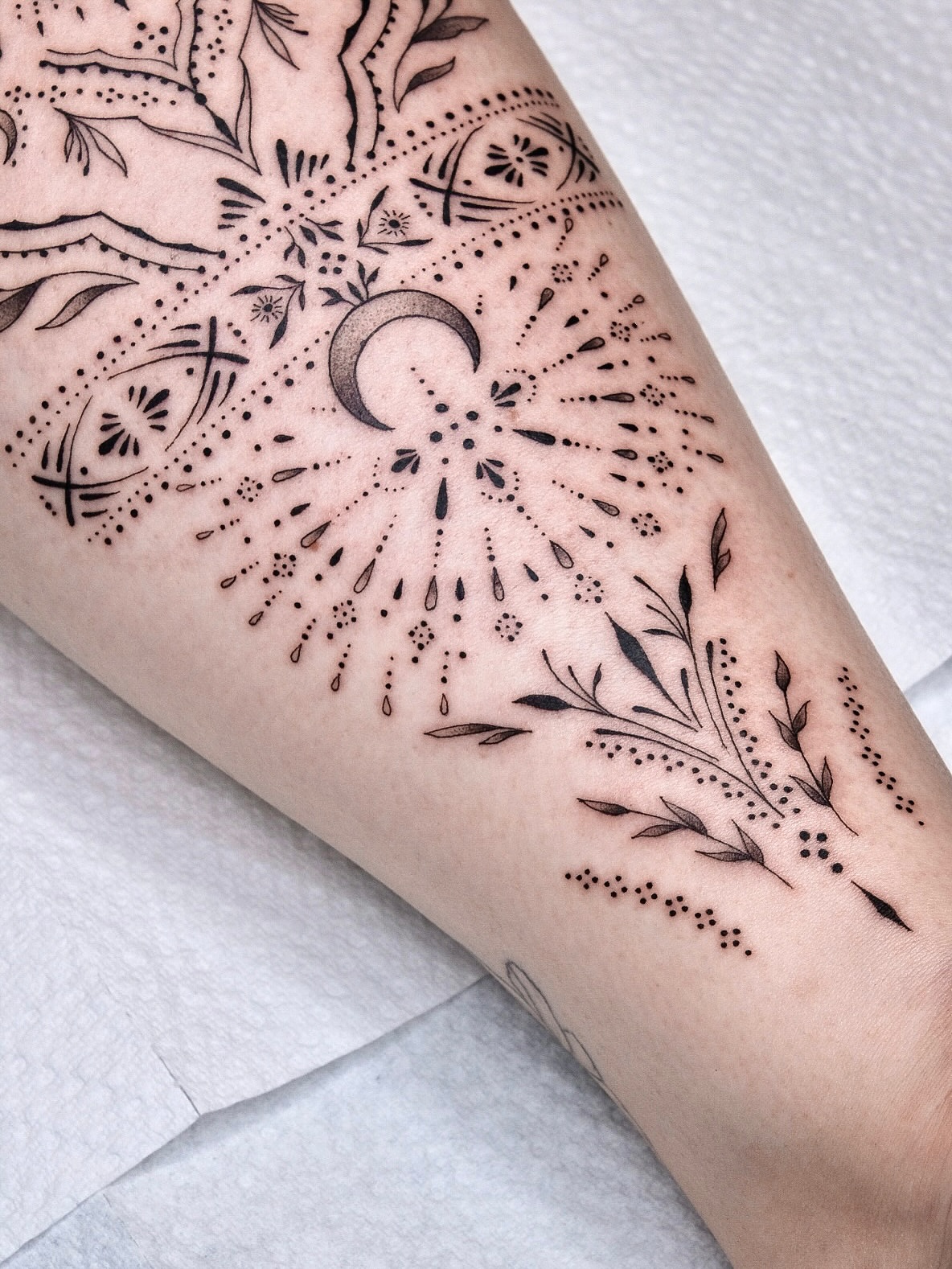 Moon and floral mandala dotwork tattoo on the forearm by Your tattoo Artist, New York, New York