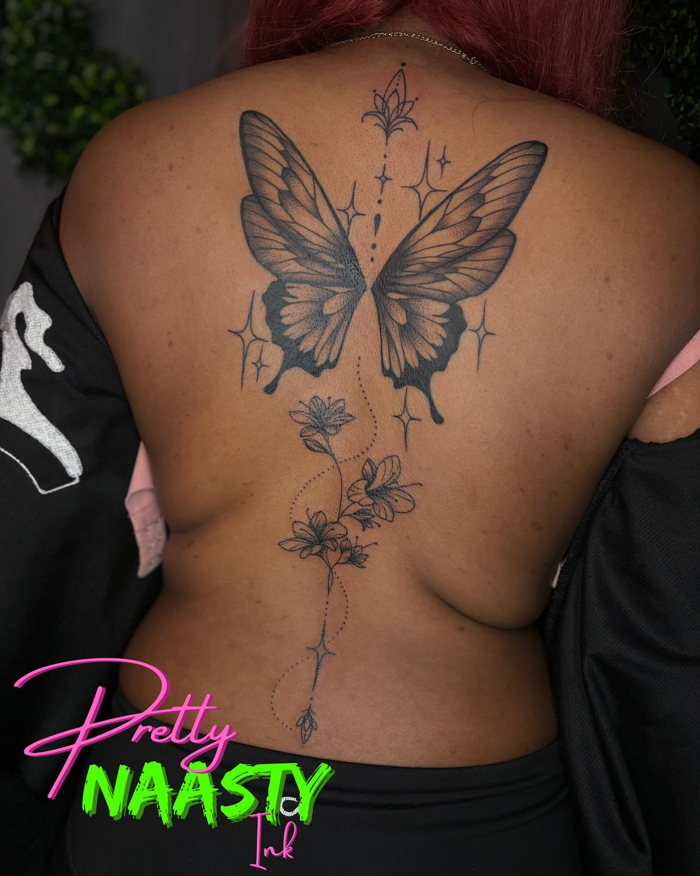 Butterfly and flowers black and grey tattoo on the back by Pretty Naasty Ink🖤