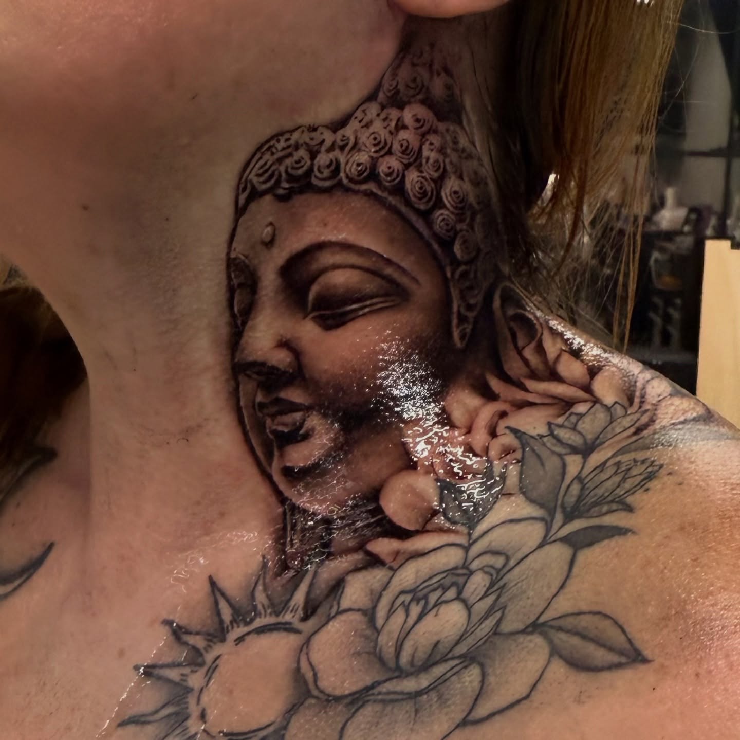 Buddha with roses realism tattoo on the chest by Grace P