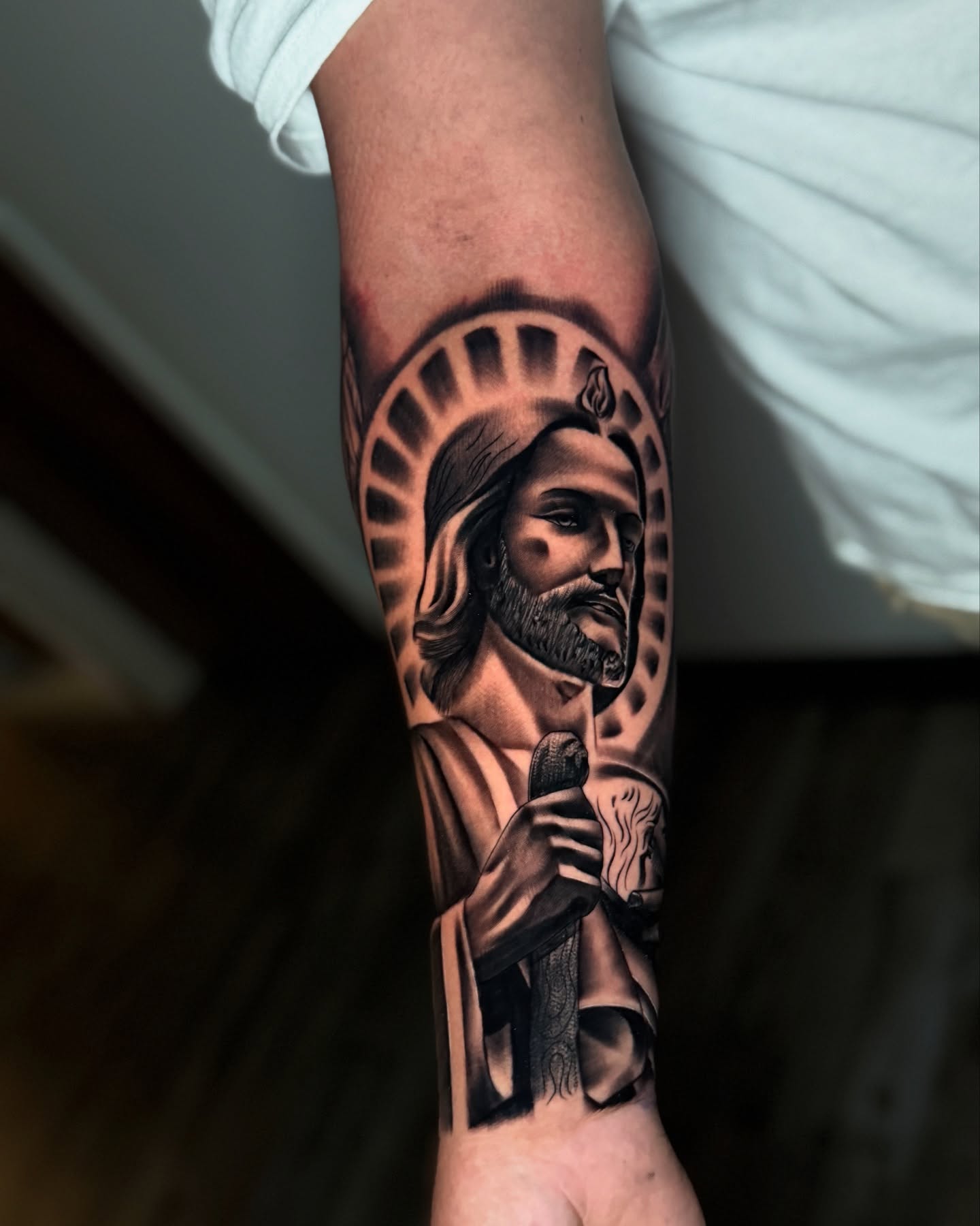 Religious figure black and grey tattoo on the forearm by Aaron Saenz jr