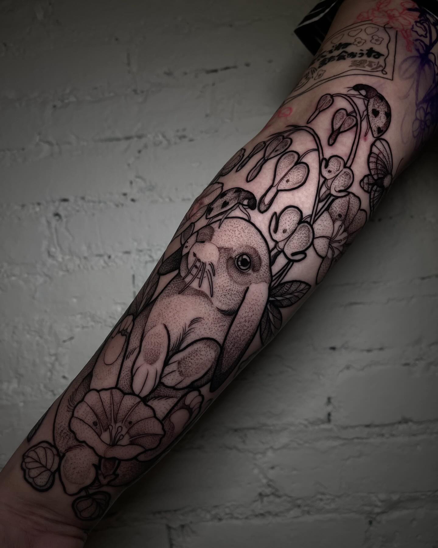 Rabbit and flowers dotwork tattoo on the forearm by H A N N A H, Colorado Springs, Colorado