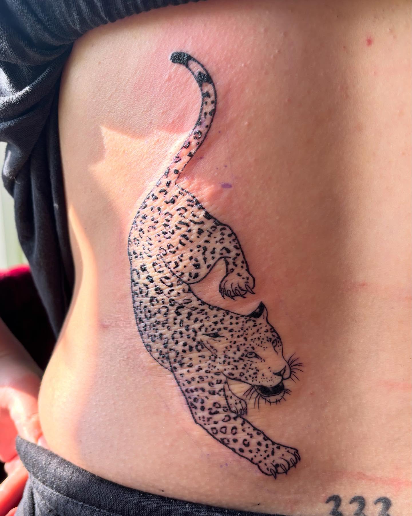 Leopard realism tattoo on the ribs by Anna Kathleen, Des Moines, Iowa