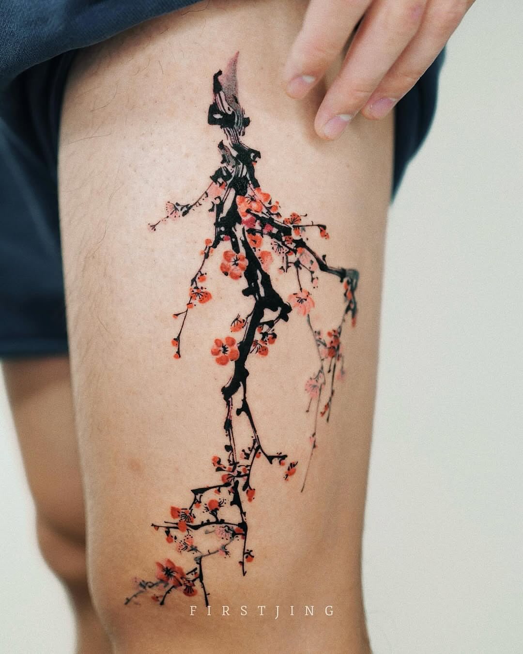Cherry blossom tree watercolor tattoo on the thigh by Seattle