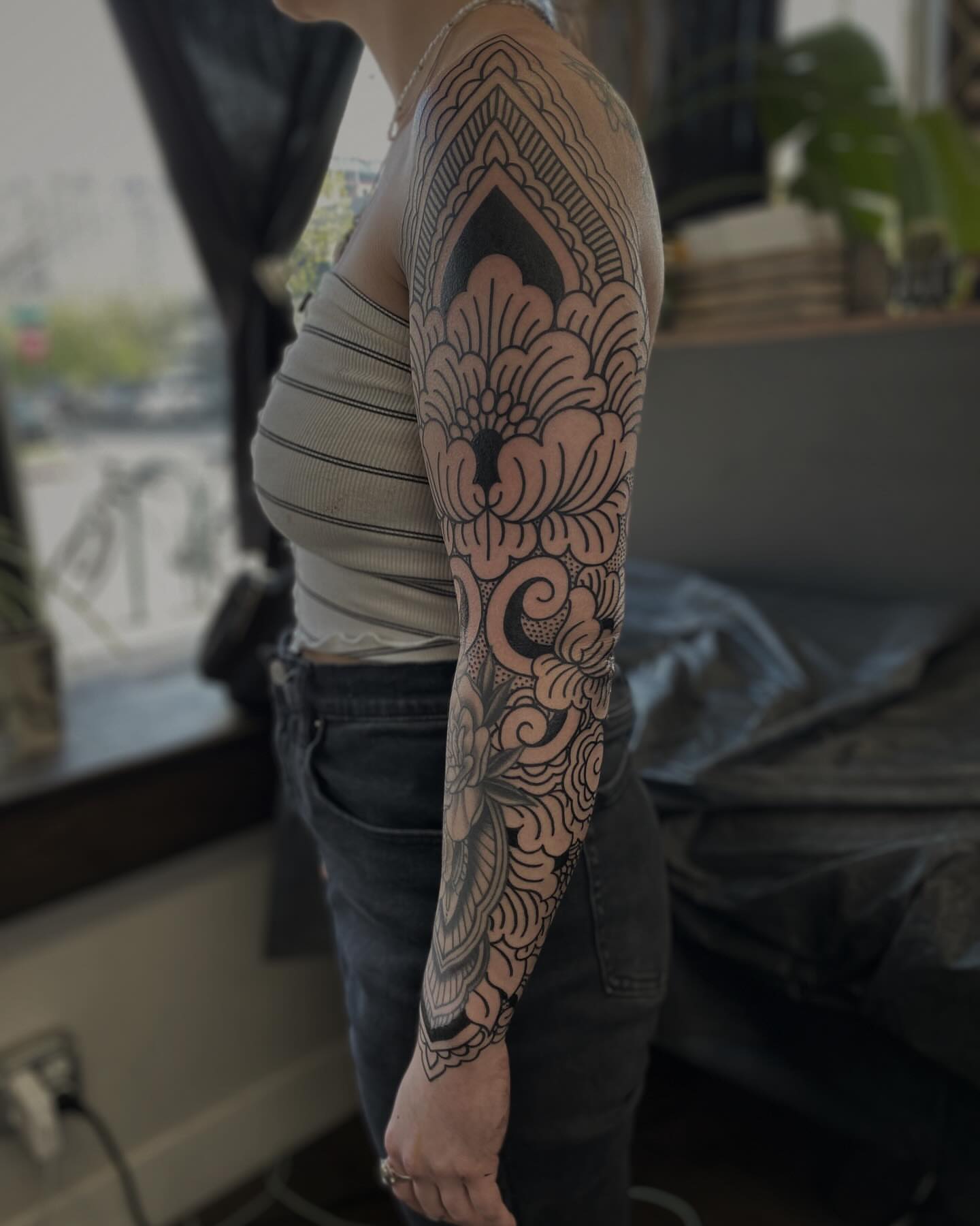 Floral mandala geometric tattoo on the forearm by Veronica