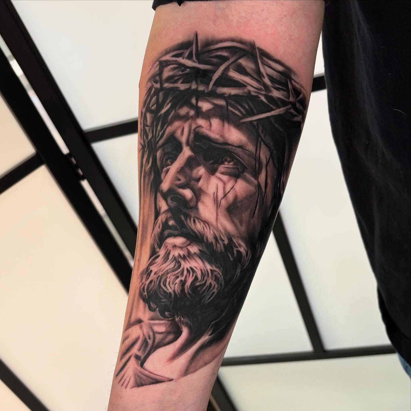 Jesus Christ realism tattoo on the forearm by Amy Kolton