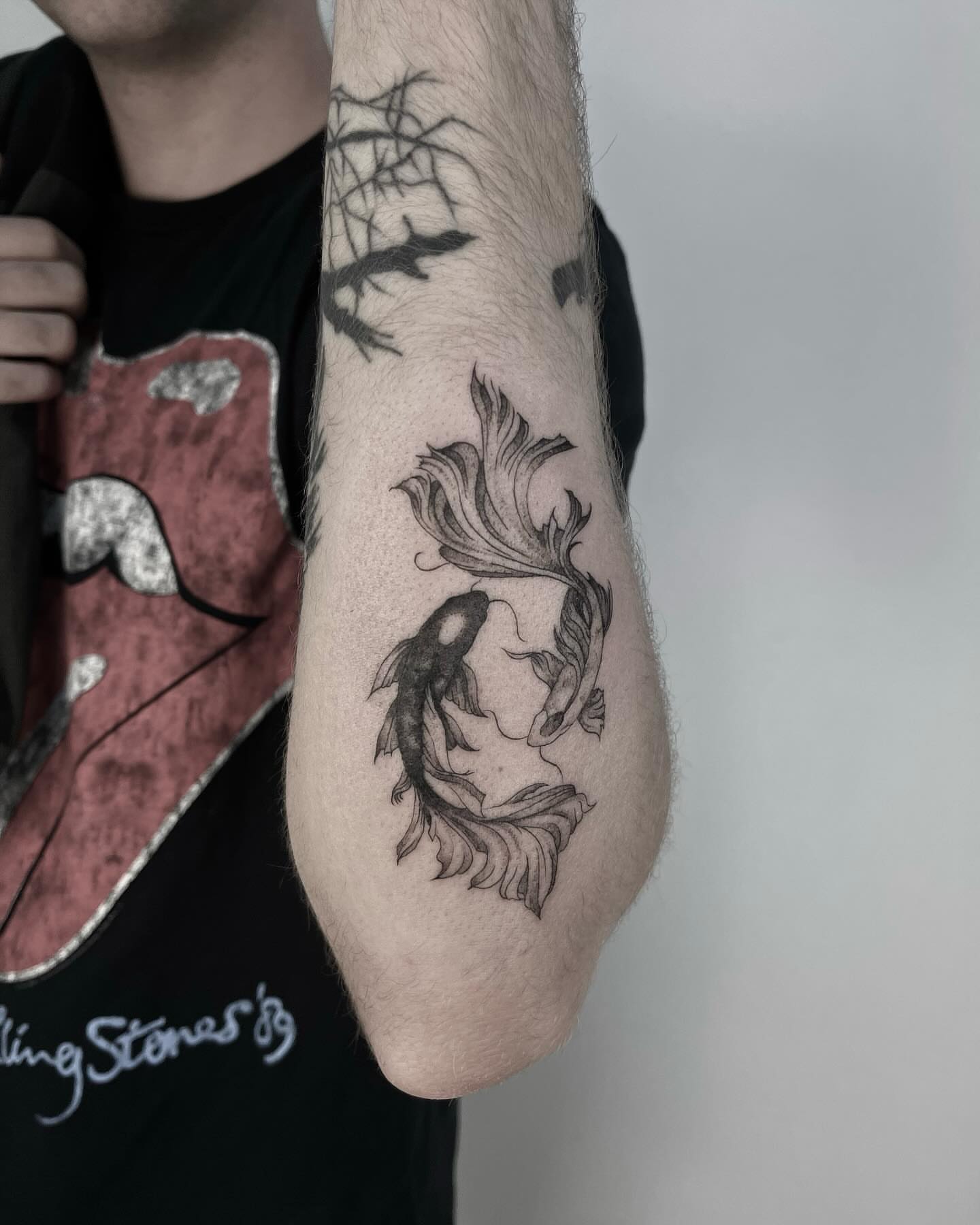 Koi fish black and grey tattoo on the forearm by ππππππ