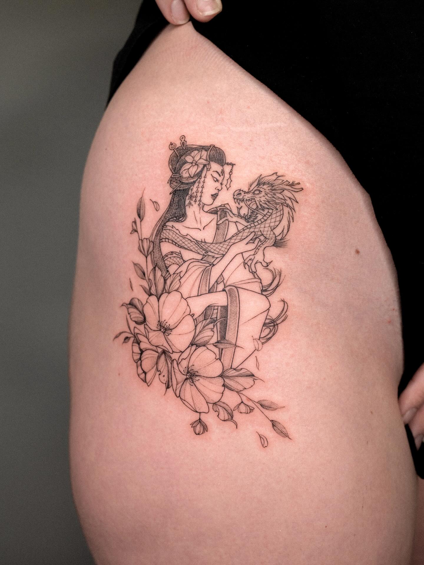 Woman and dragon realism tattoo on the thigh by ๐๐๐ฆ ๐๐ ๐ฎ๐ฒ๐๐ง