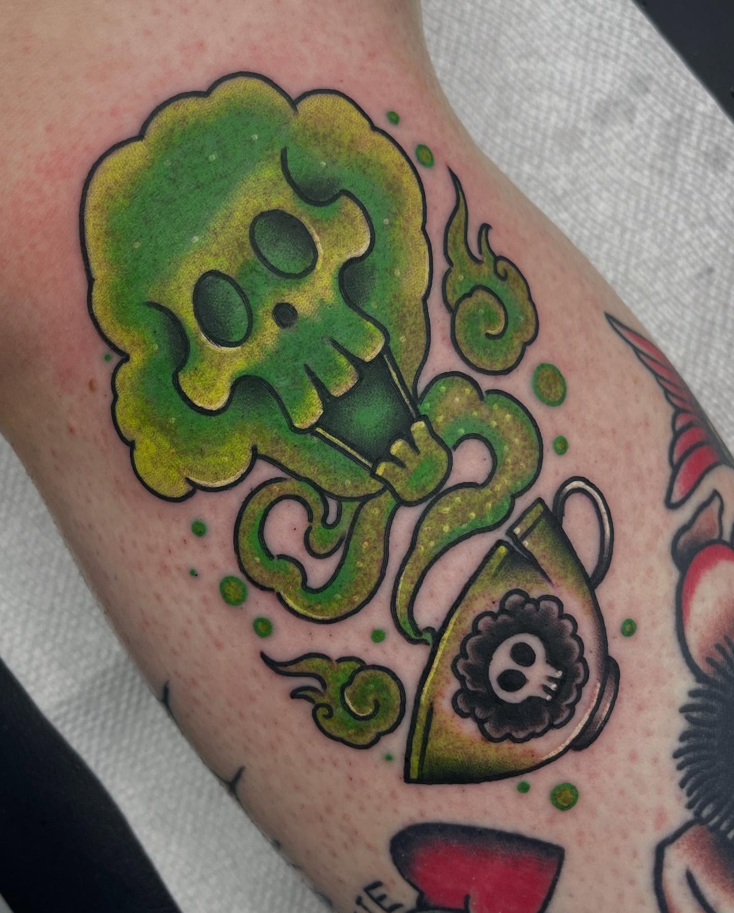 Skull and tea cup American traditional tattoo on the forearm by Autumn Fulford