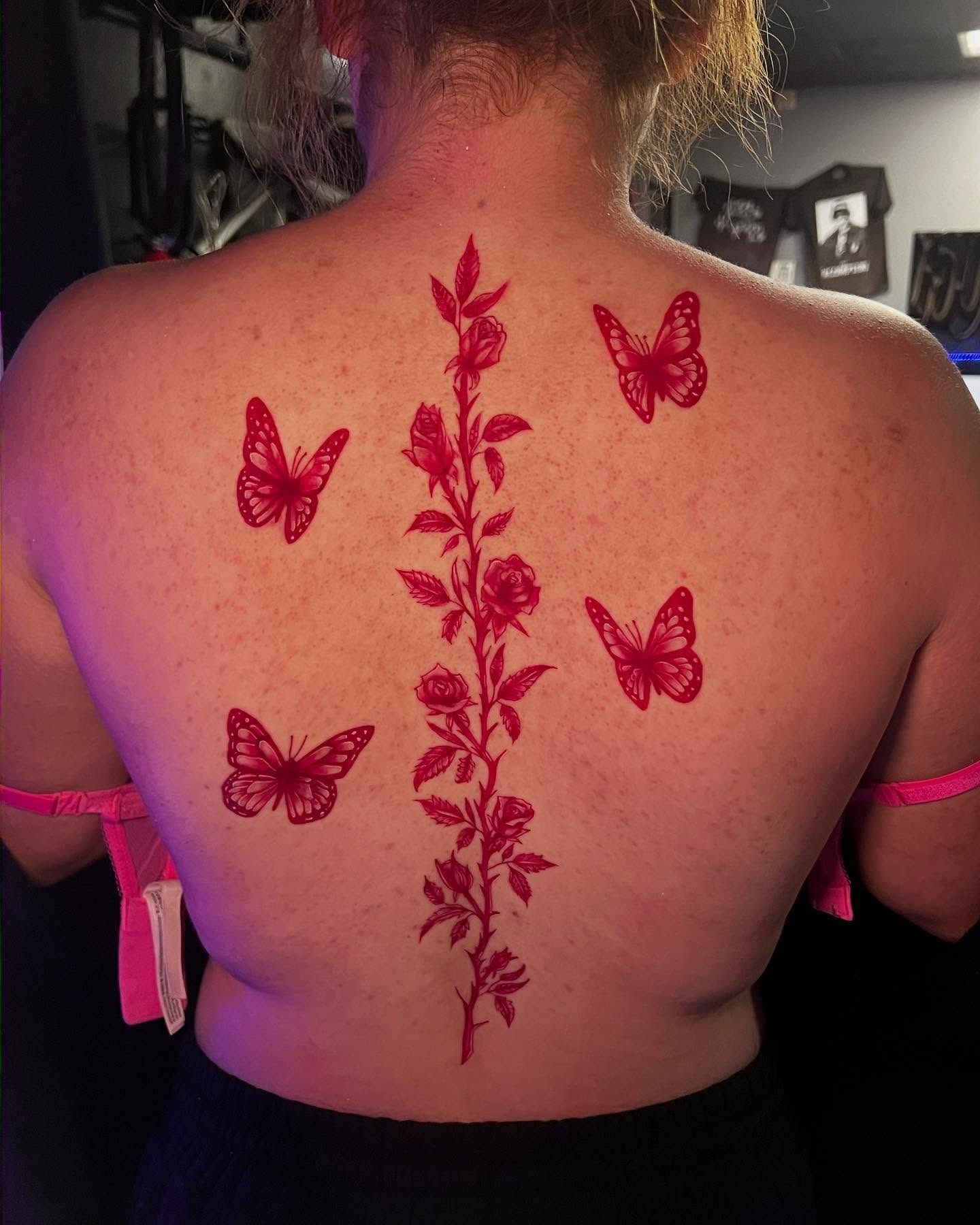 Flowers and butterflies new school tattoo on the back by Jasmin Lozano