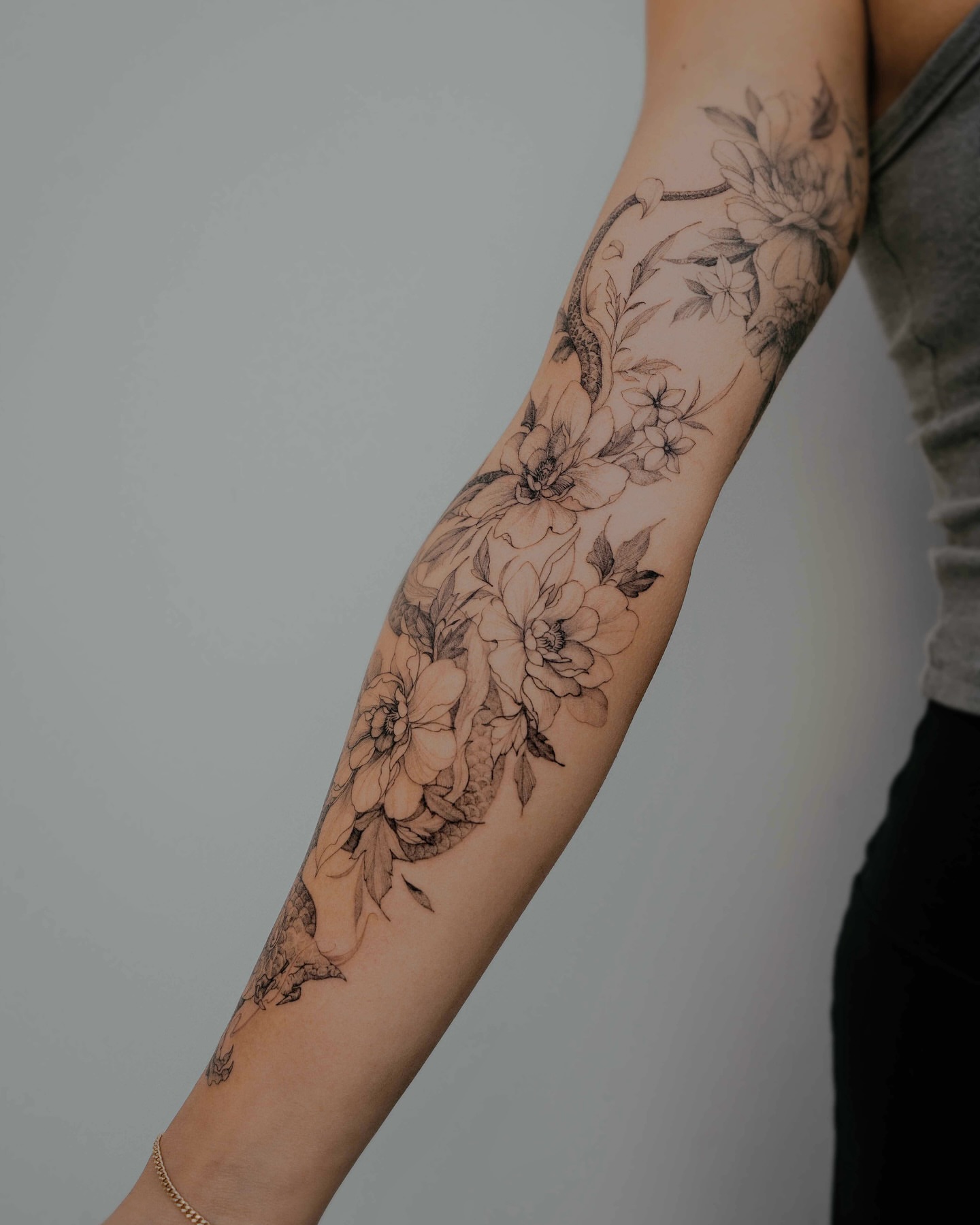 Floral vine black and grey tattoo on the forearm by Yeonji