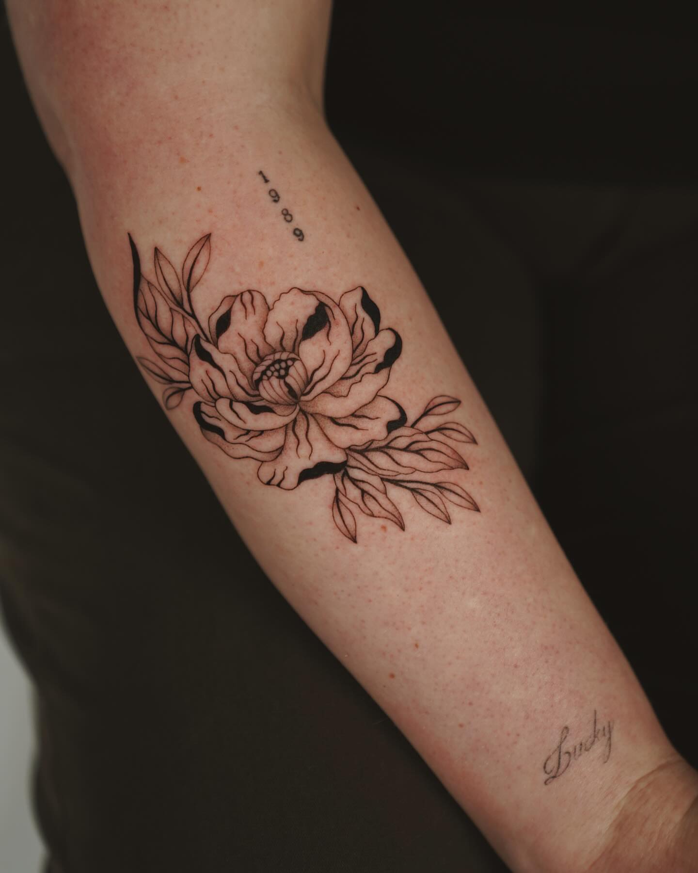 Peony flowers black and grey tattoo on the forearm by b i l l i e, Seattle, Washington