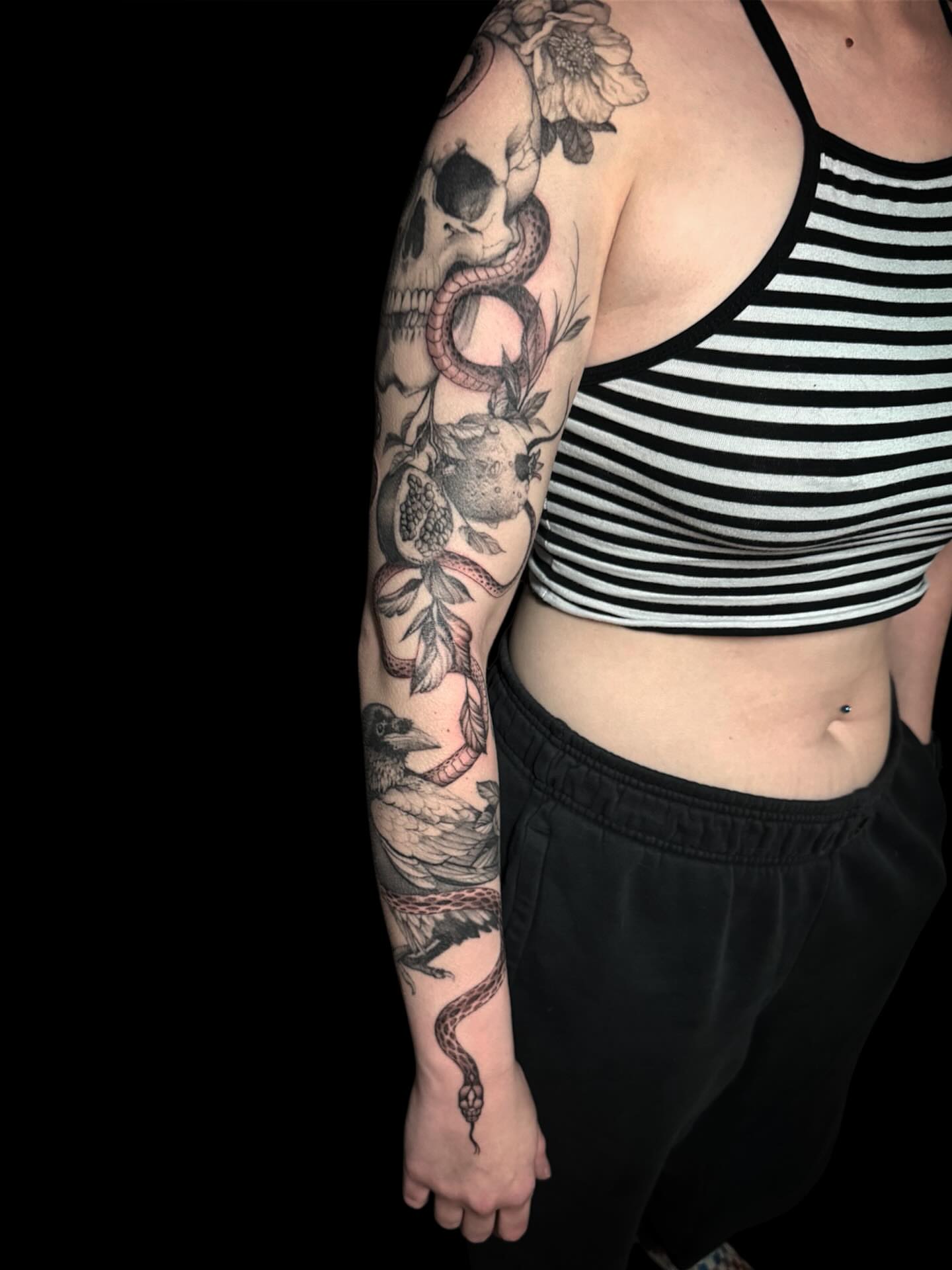 Skull and snake black and grey tattoo on the upper arm by Brennan Walker, Orem, Utah
