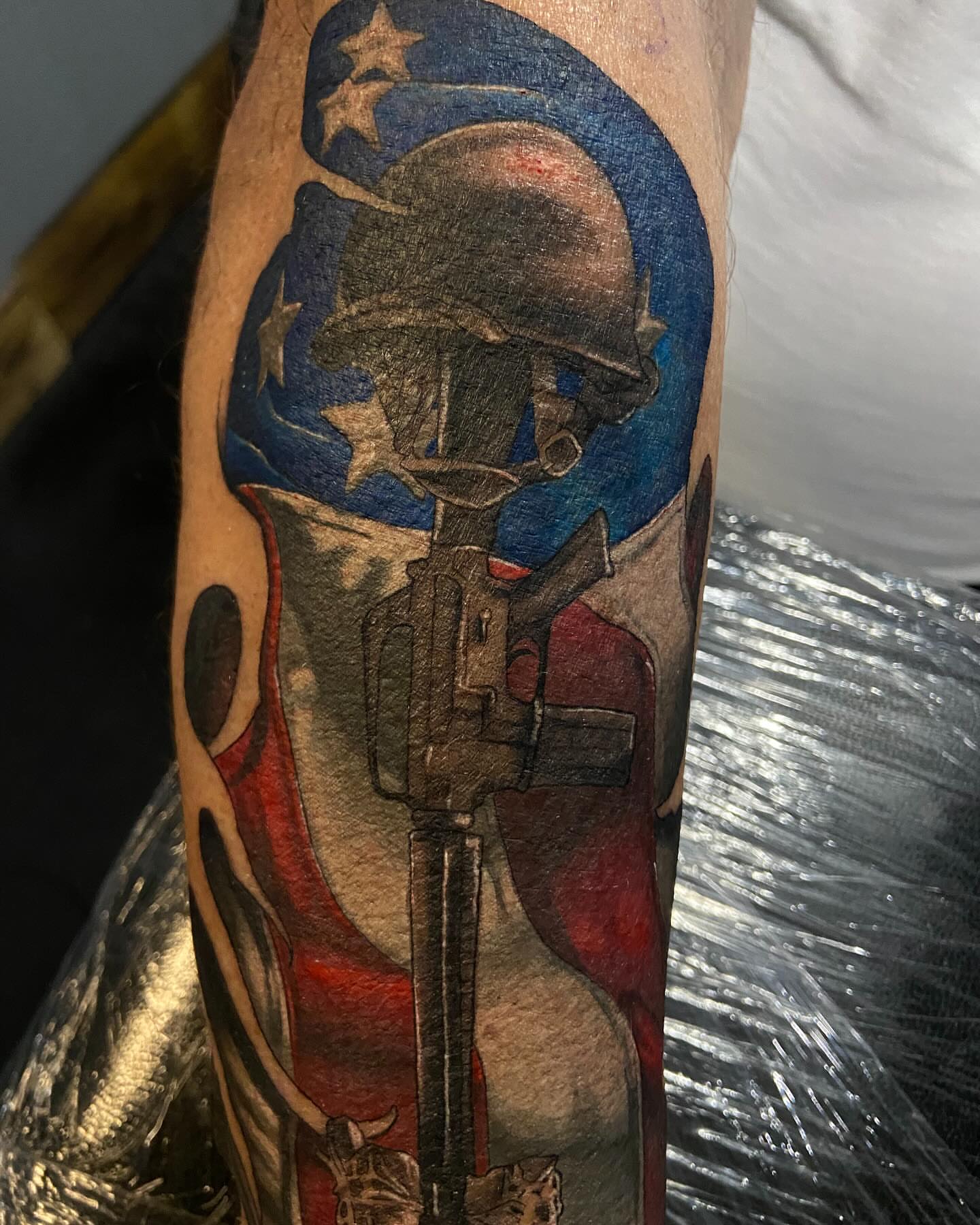 Soldier with rifle American traditional tattoo on the forearm by Slade Nowicki