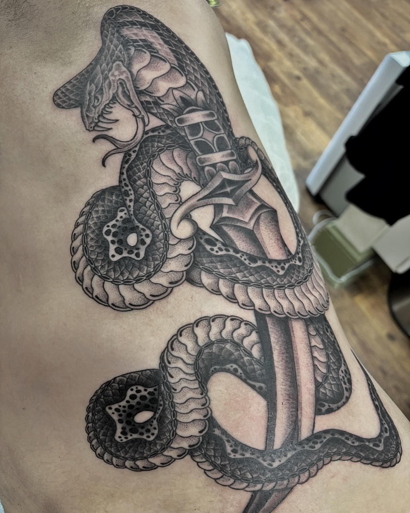 Snake dotwork tattoo on the thigh by Pat Moser