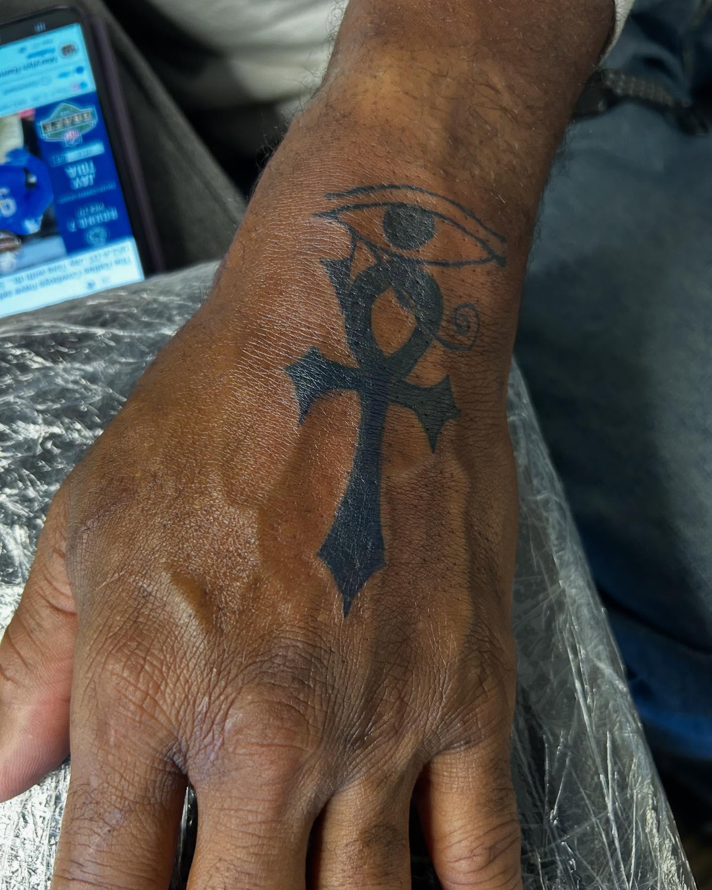 Eye of horus black and grey tattoo on the forearm by Airika Edwards