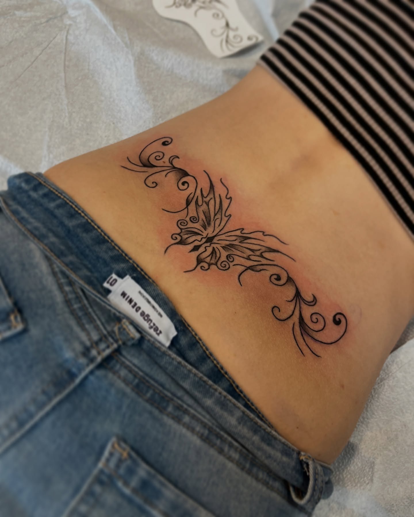 Butterfly black and grey tattoo on the ribs by Wes Rose-Moon