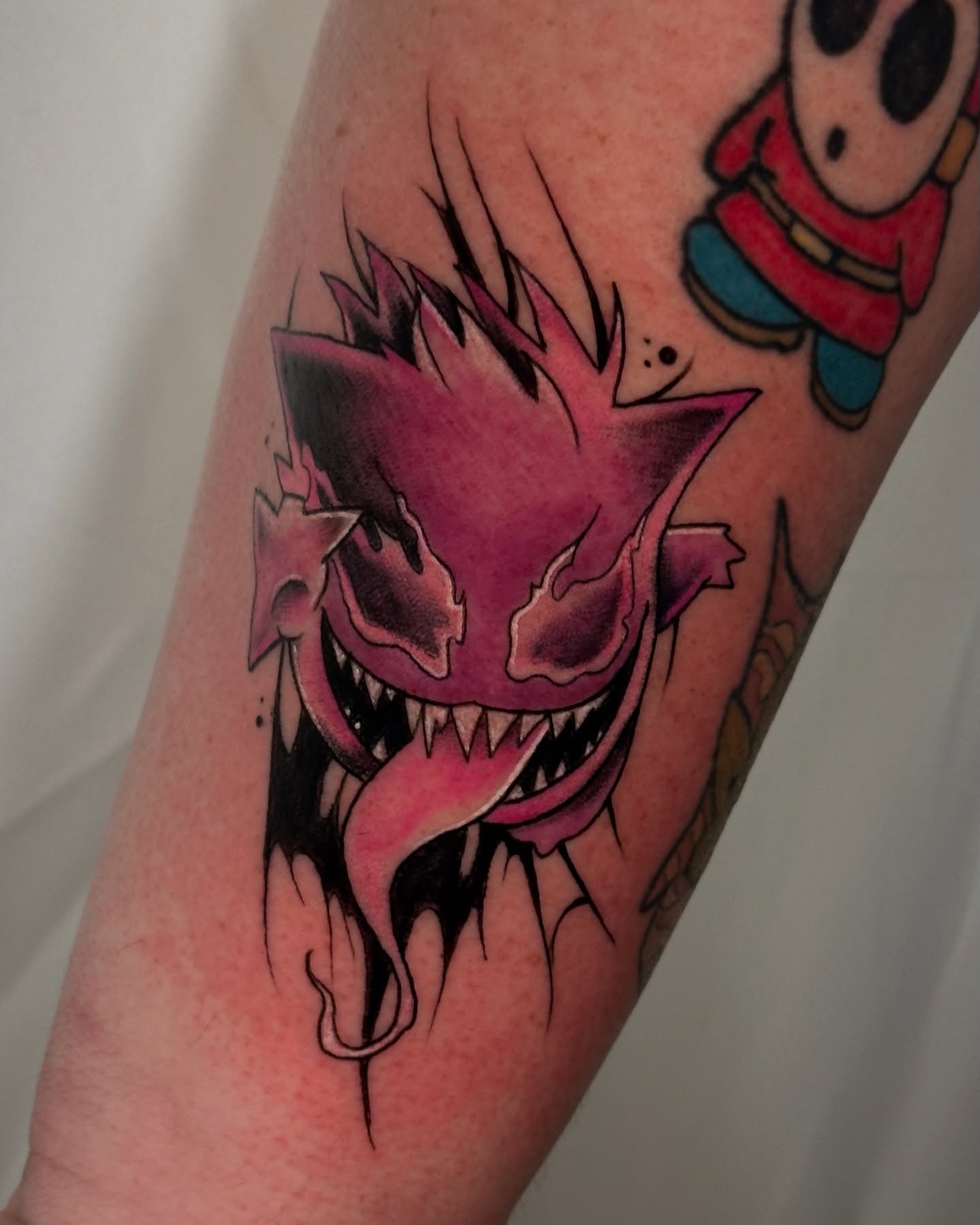 Demon dark realism tattoo on the forearm by zoe mars