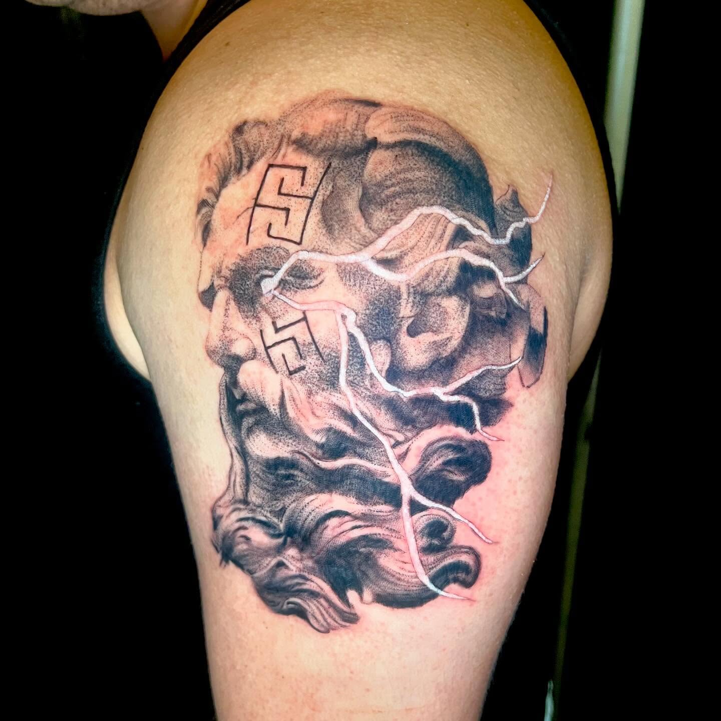 Storm cloud realism tattoo on the shoulder by Prncjordn, Stallings, North Carolina