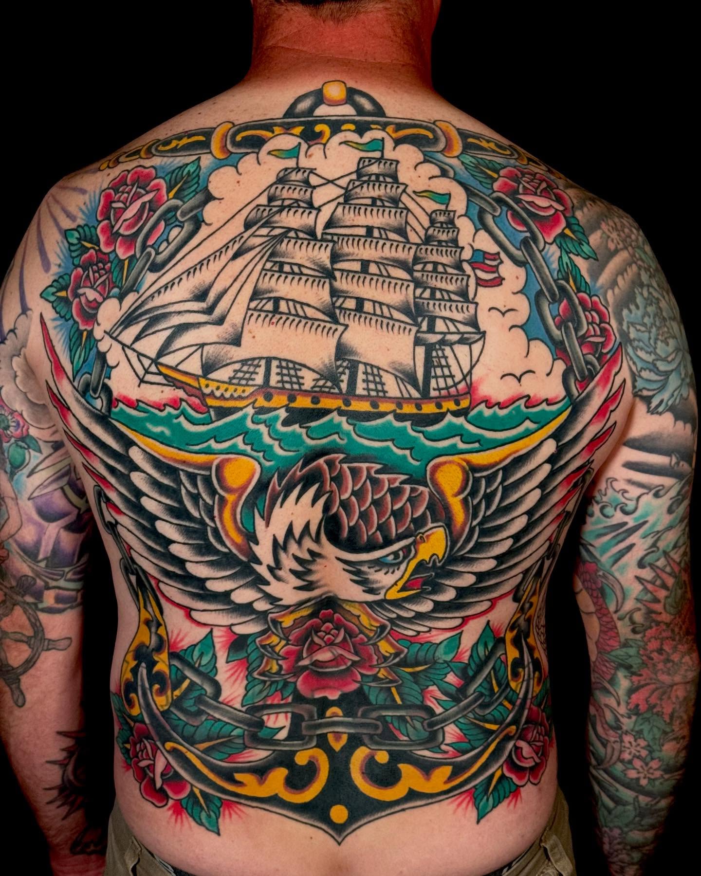 Ship and eagle American traditional tattoo on the back by Nick Rodin