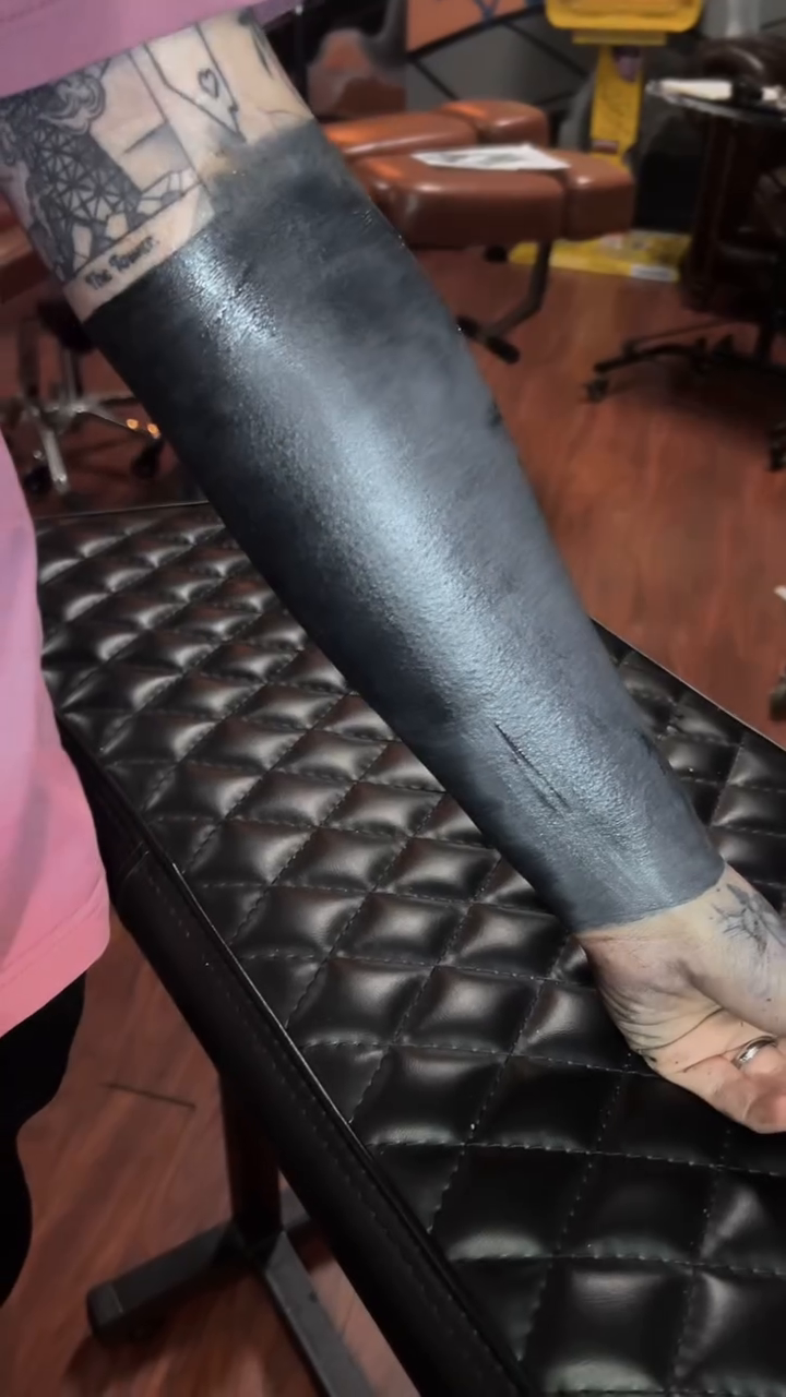Full arm coverage blackwork tattoo by Brittney