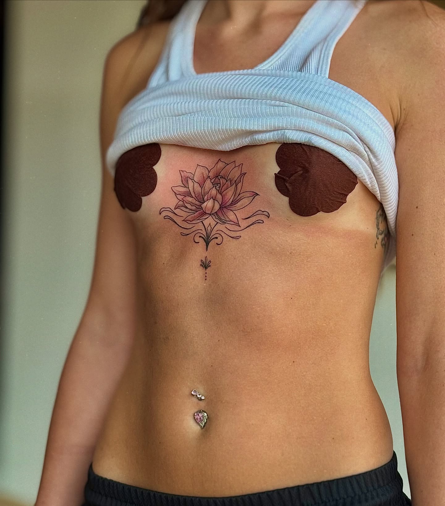 Lotus flower dotwork tattoo on the torso by Jewels, St. George, Utah